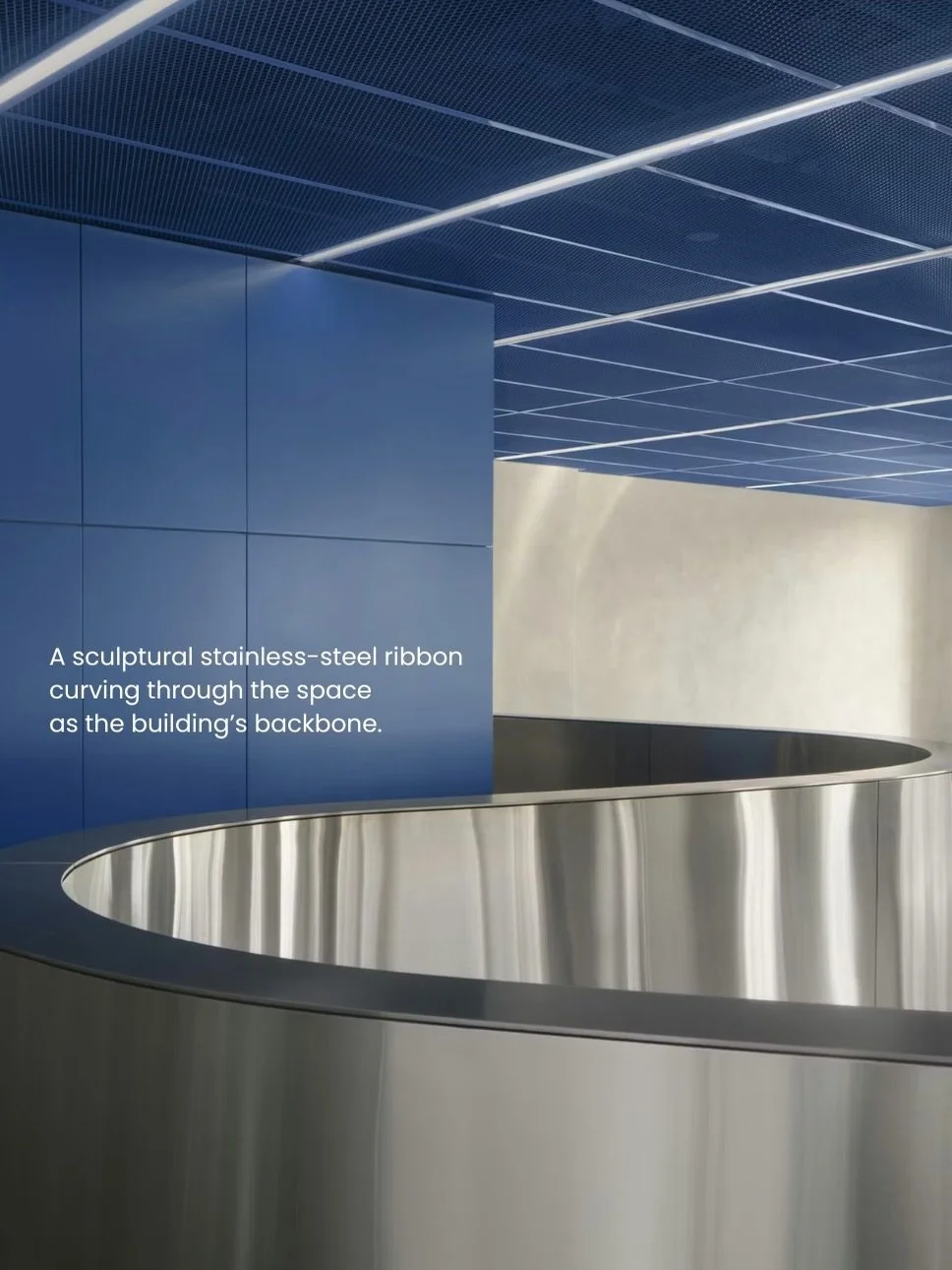 At the centre of the plan, a sculptural stainless-steel ribbon becomes the project&rsquo;s organising element. Rising to 1500 millimetres and curving fluidly through the space, it delineates reception, meeting areas, workspaces, and amenities while m