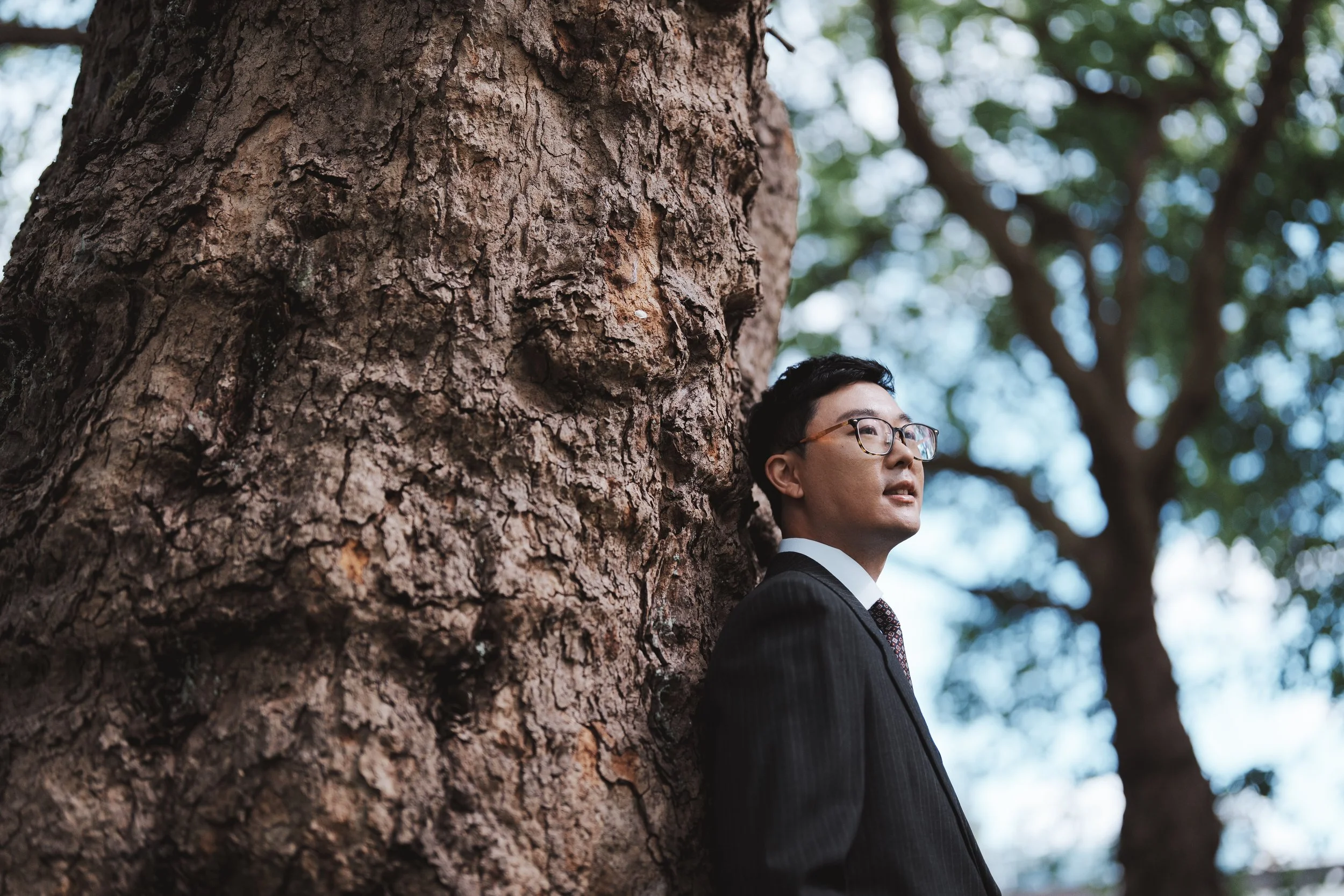 Marco beside a towering tree at Stanley Park, Vancouver