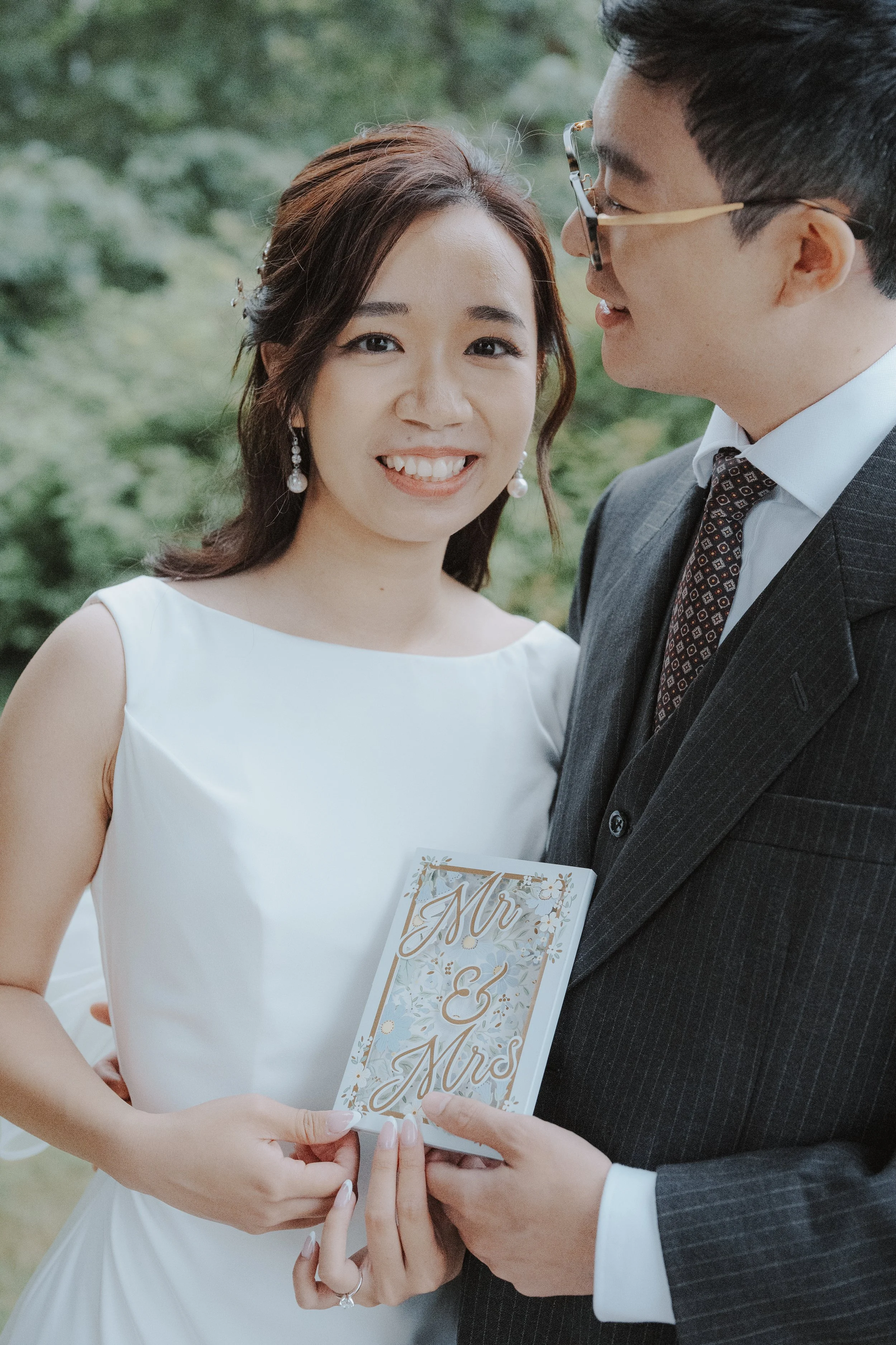 Chloe and Marco with their Mr and Mrs card