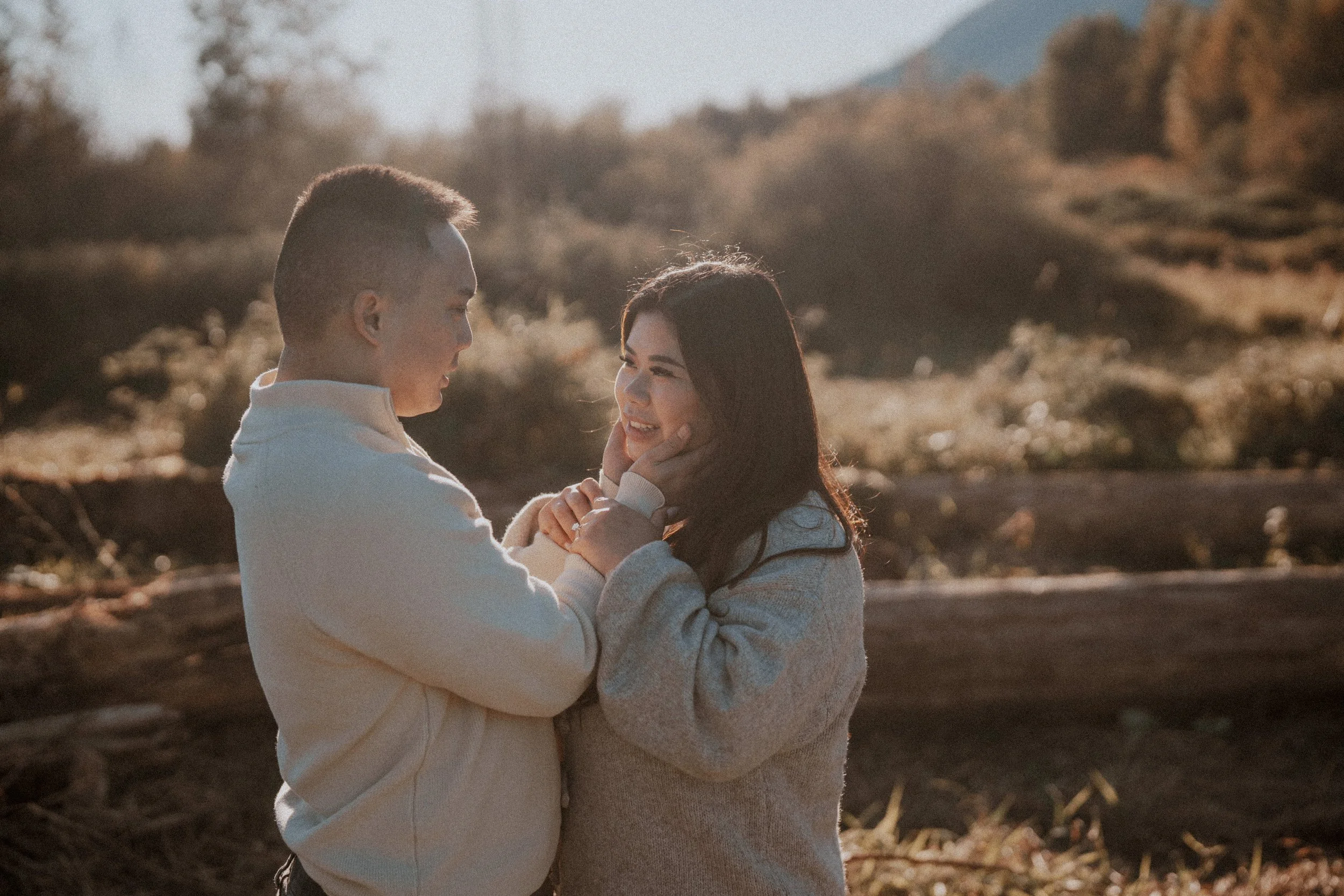  A genuine moment of connection: the bride gently touches the groom's face, capturing pure affection. 