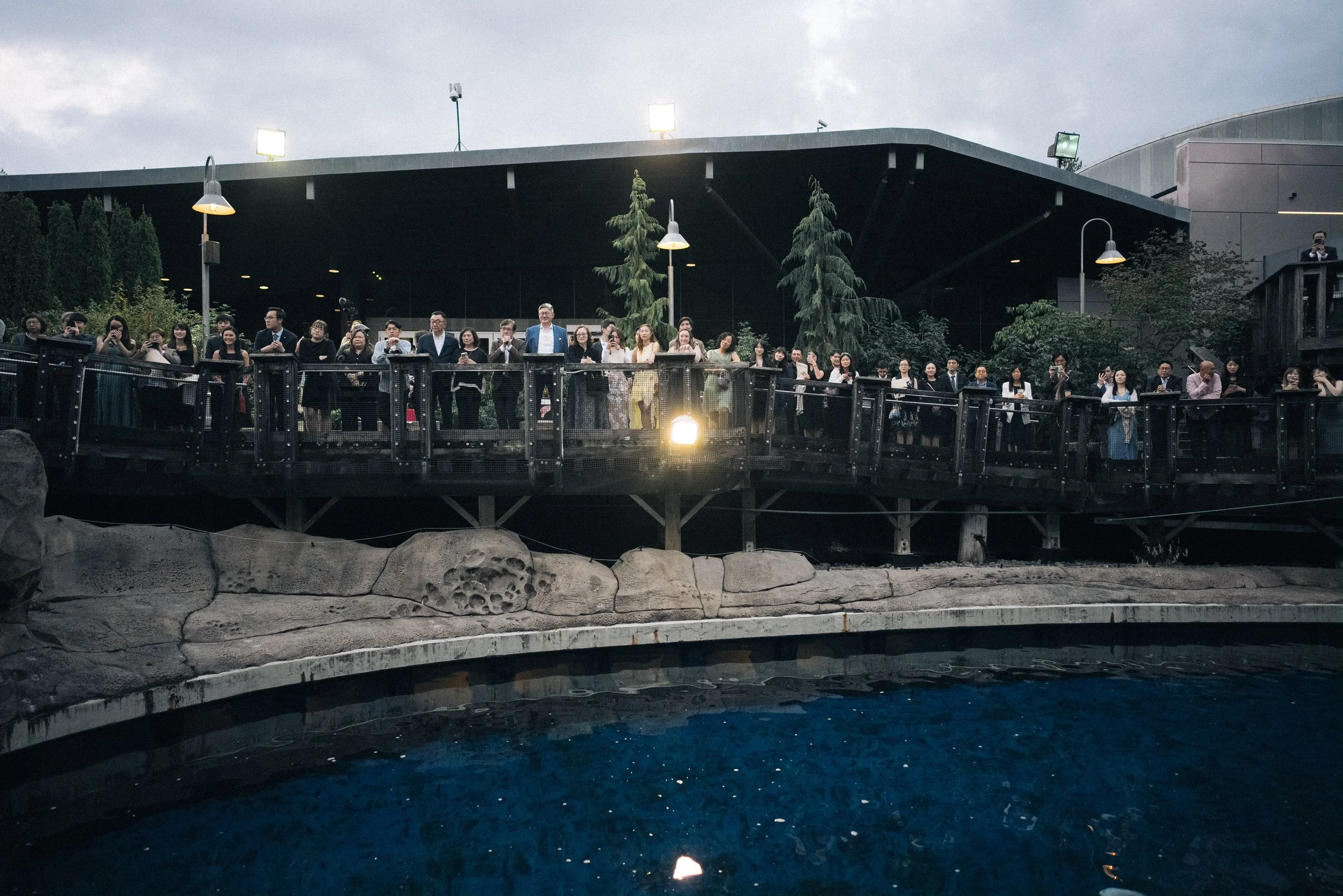  Guests gather on the viewing deck, overlooking the water exhibit during the unique  Aquarium reception . 