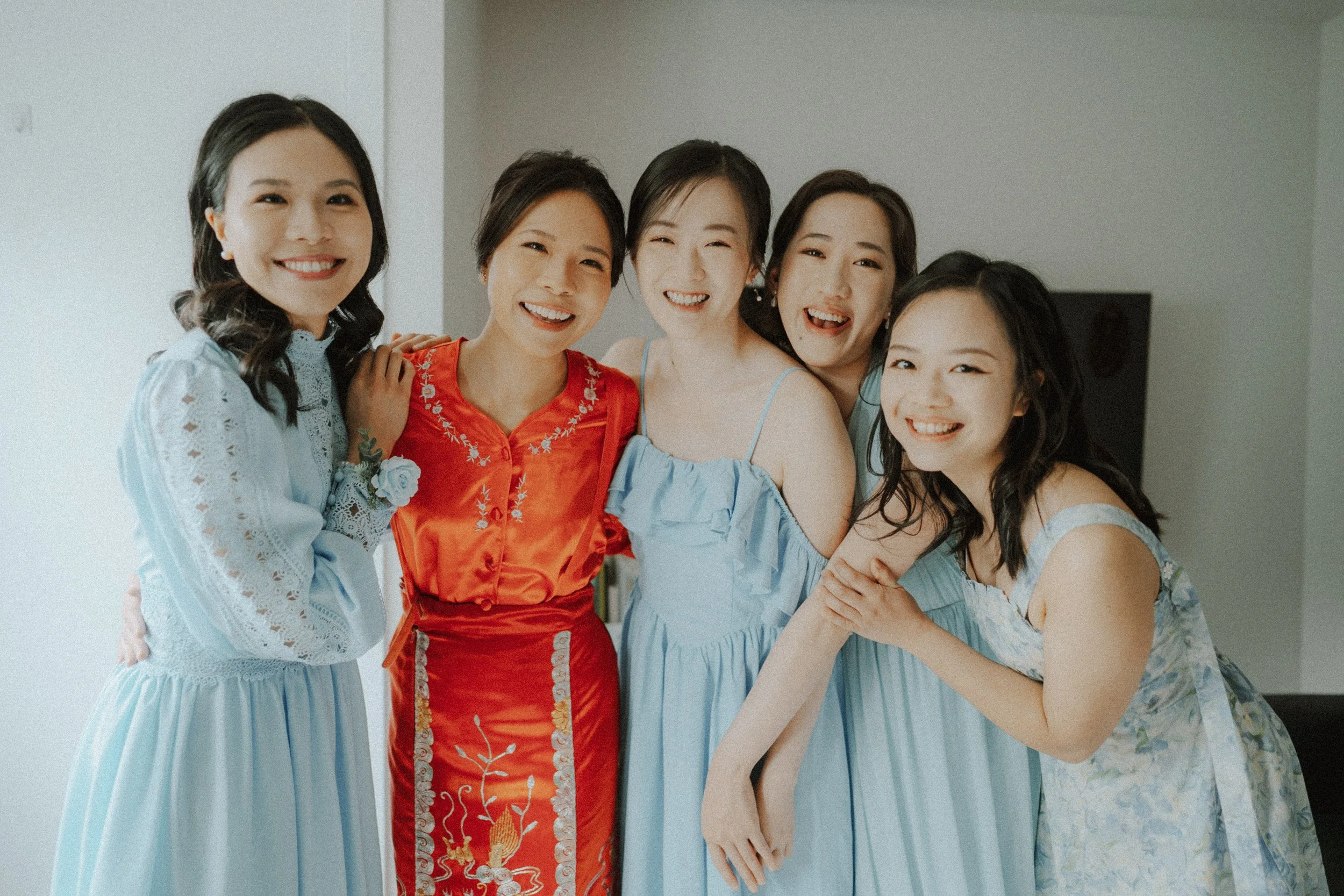  A beautiful moment of laughter and joy with the bride in her traditional  Qun Gua  and her bridesmaids. Capturing the warm emotions of the  wedding morning . 