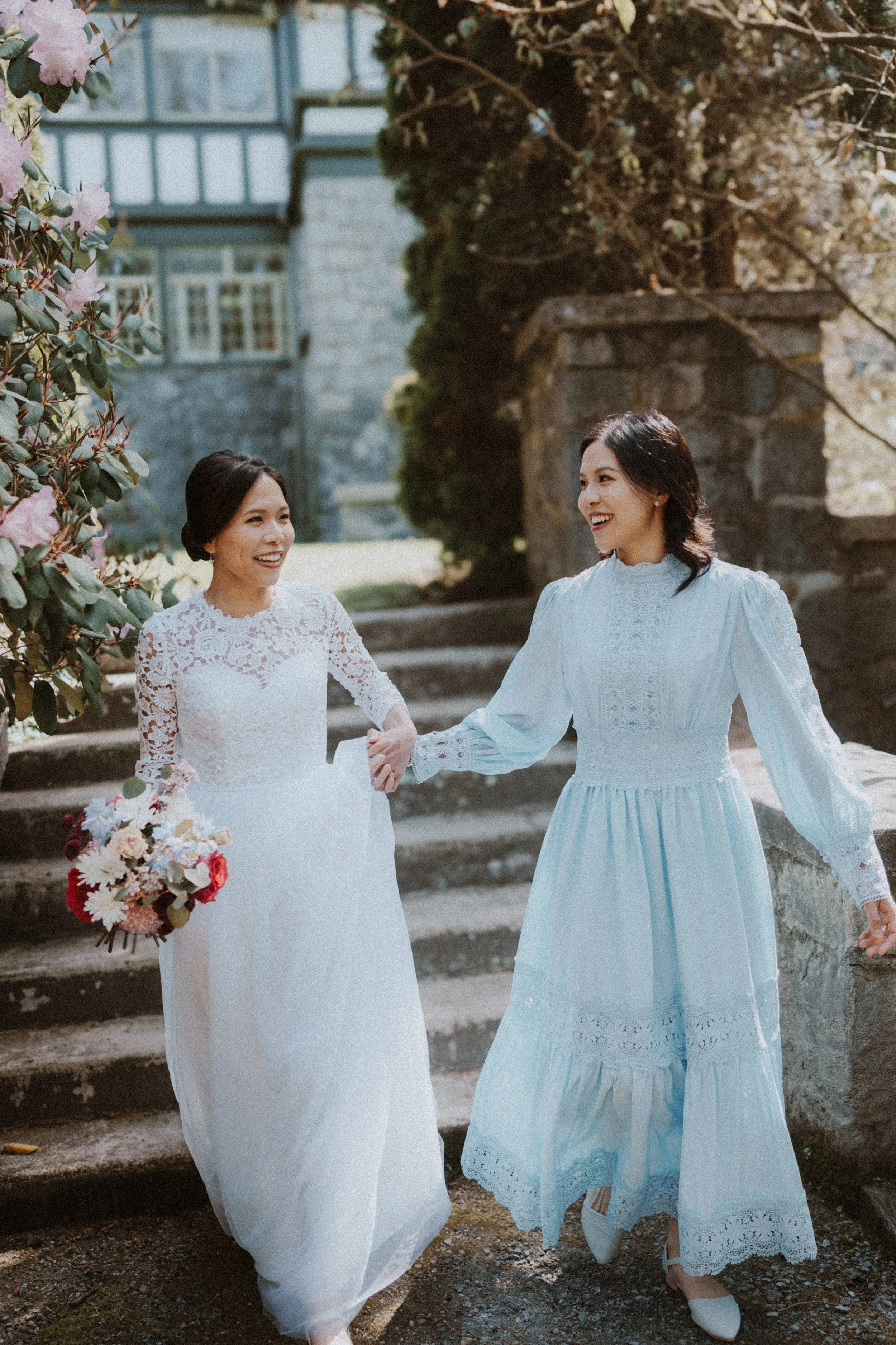  An incredibly sweet and emotional moment: the bride holds hands with her sister, sharing a beautiful laugh right before the ceremony at the historic  Aberthau Mansion . 