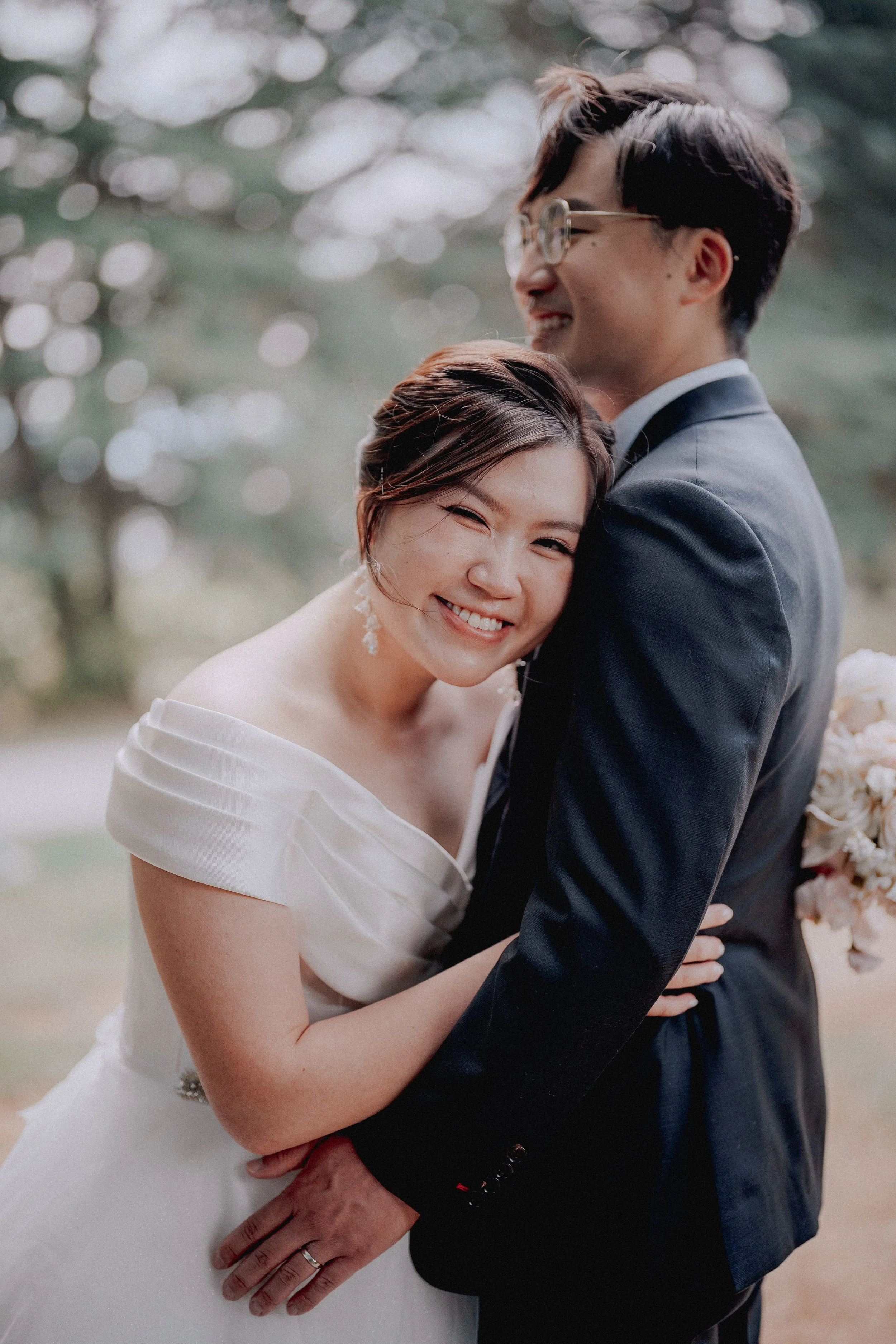  A genuine, heartwarming smile as the bride embraces the groom. Capturing real happiness. 