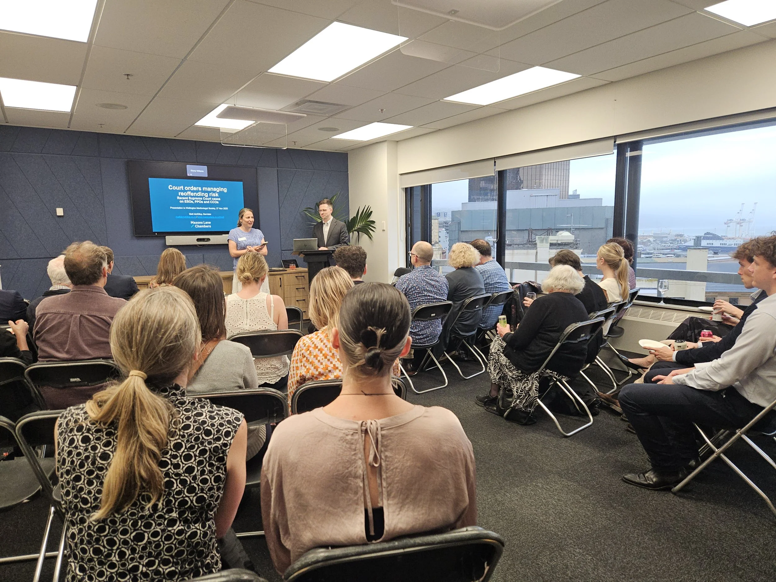 Speakers introduce the audience to a talk about medicine and law