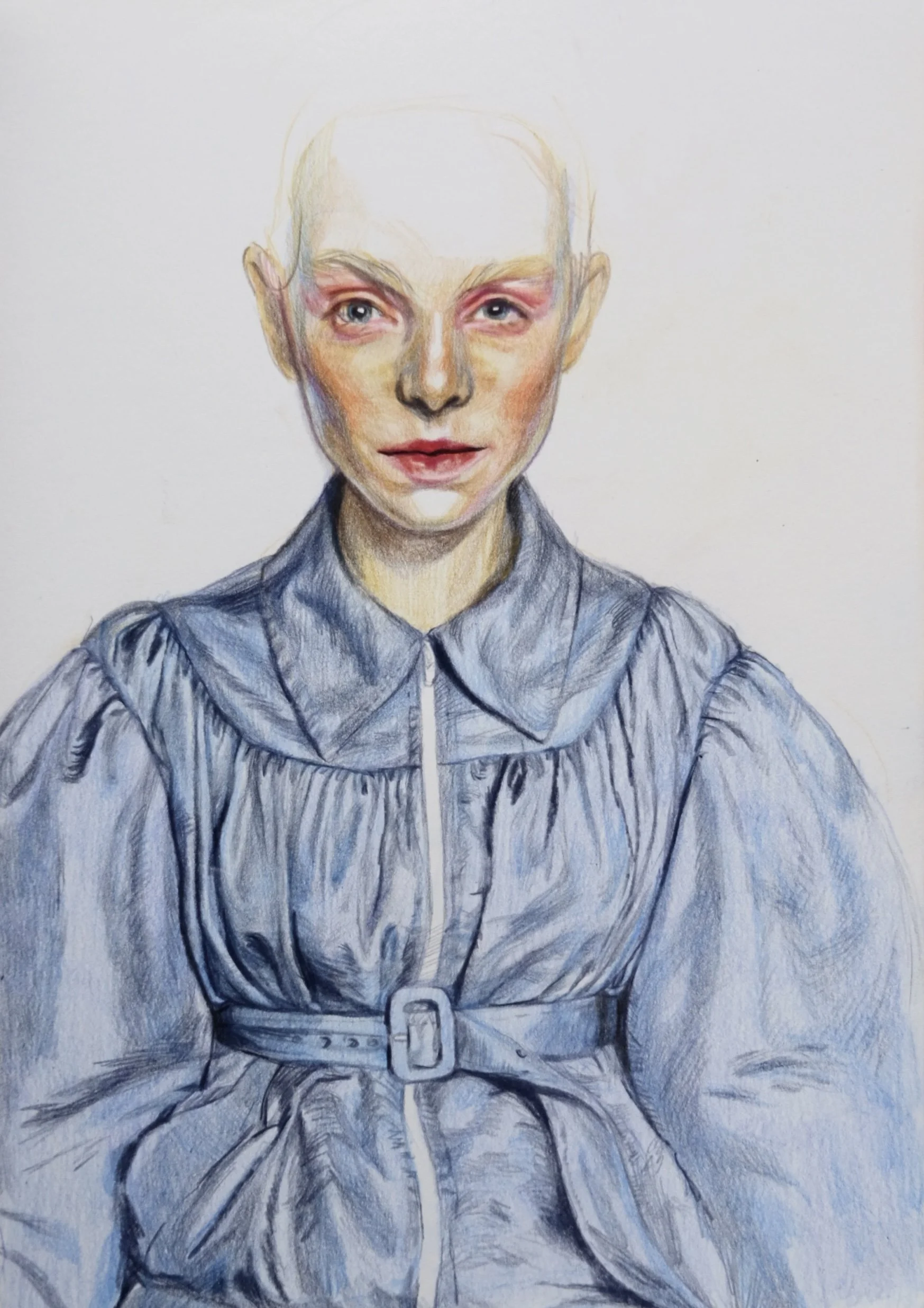 A colored pencil drawing of a young woman with blonde hair, blue eyes, and pink eyeshadow, wearing a blue jacket with a zipper and a belt.