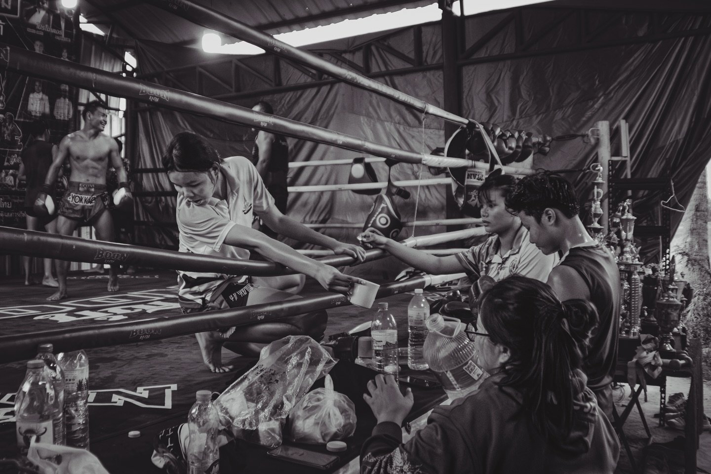 The cost of endurance for the female fighters at Por MuangPhet Gym is measured in 17-minute pad rounds &mdash; nearly 6 times the standard length at other gyms. 

In the brief space between, the Nak Muay Ying execute a quiet, essential ritual: water,