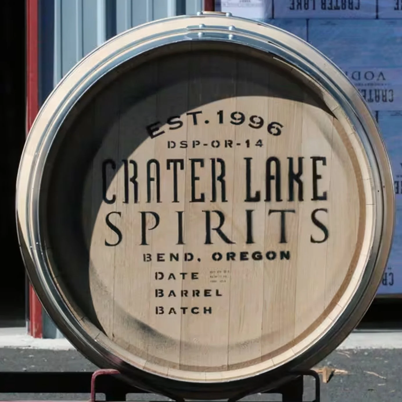Large branding stencil applied to a wooden barrel for custom logo and typography marking