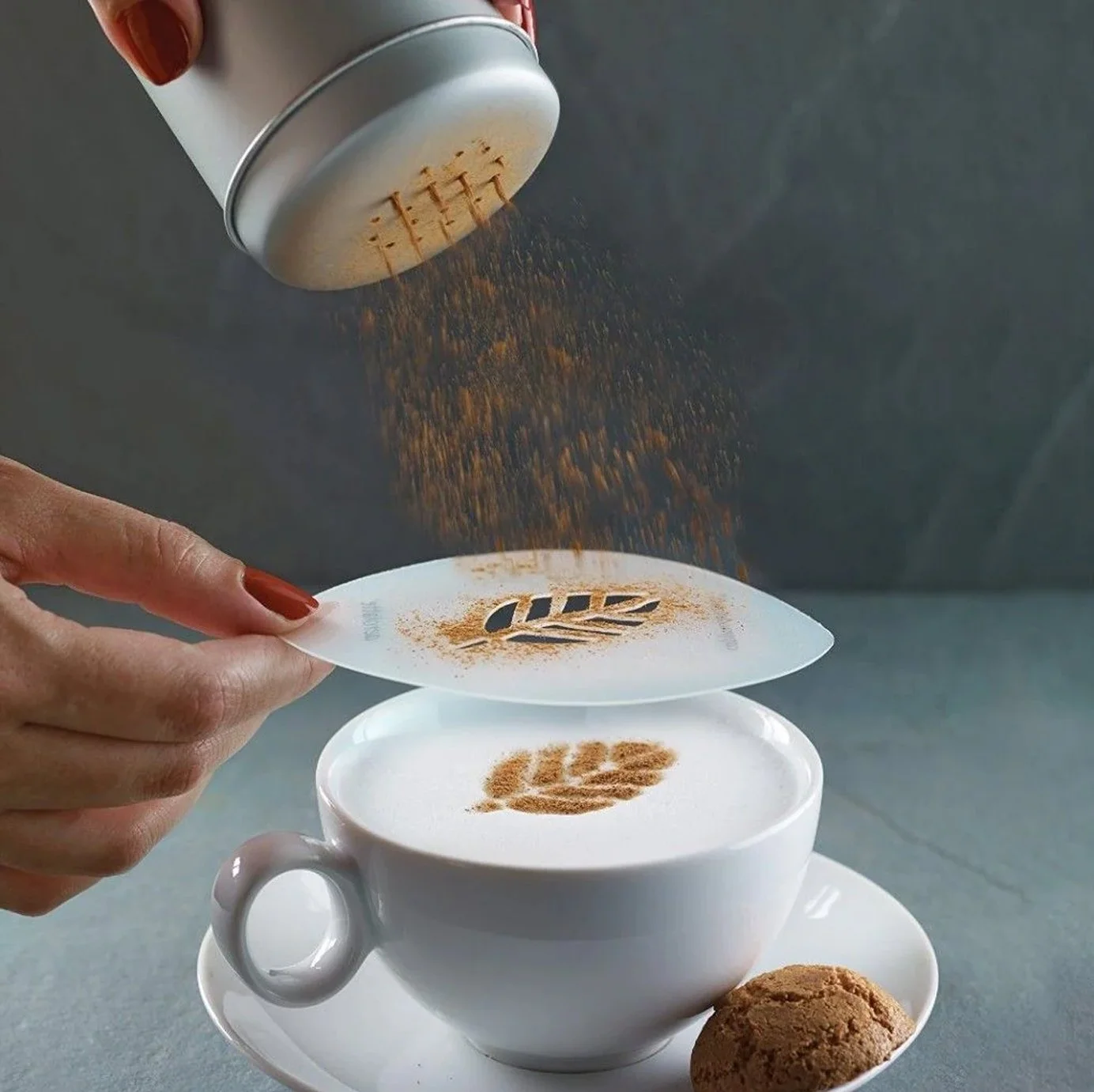 Reusable coffee stencil used to create a decorative branded design on cappuccino foam