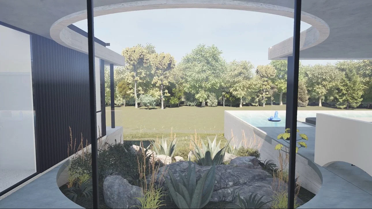Modern house with large glass windows overlooking a backyard with a fountain, trees, rocks, and plants.