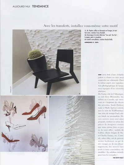 A black chair with a potted cactus placed on top, positioned against a white textured wall. Below, there are sketches of different shoe designs and a close-up of what appears to be a textured or layered fabric or paper.