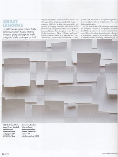Various white 3D wall-mounted paper sculptures with different heights and shapes, displayed on a white background in a modern design exhibit.