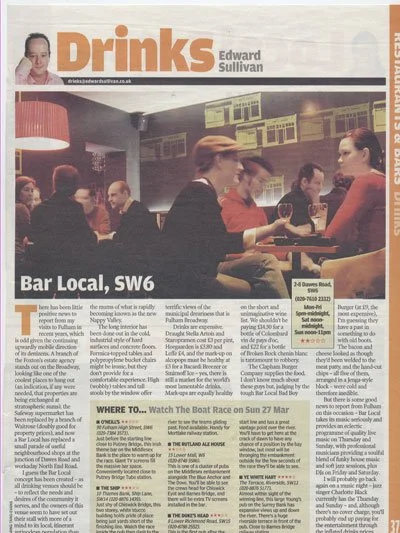 A newspaper page featuring a section titled 'Drinks' by Edward Sullivan. The page shows a busy bar scene with people socializing and drinking, with bartenders serving customers. The caption mentions 'Bar Local, SW6' and provides an address at 24 Dave