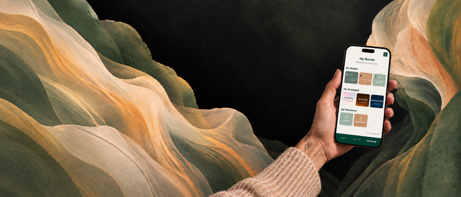 A person holding a smartphone displaying a wellness app against a background of large, layered, wavy green and beige leaves.