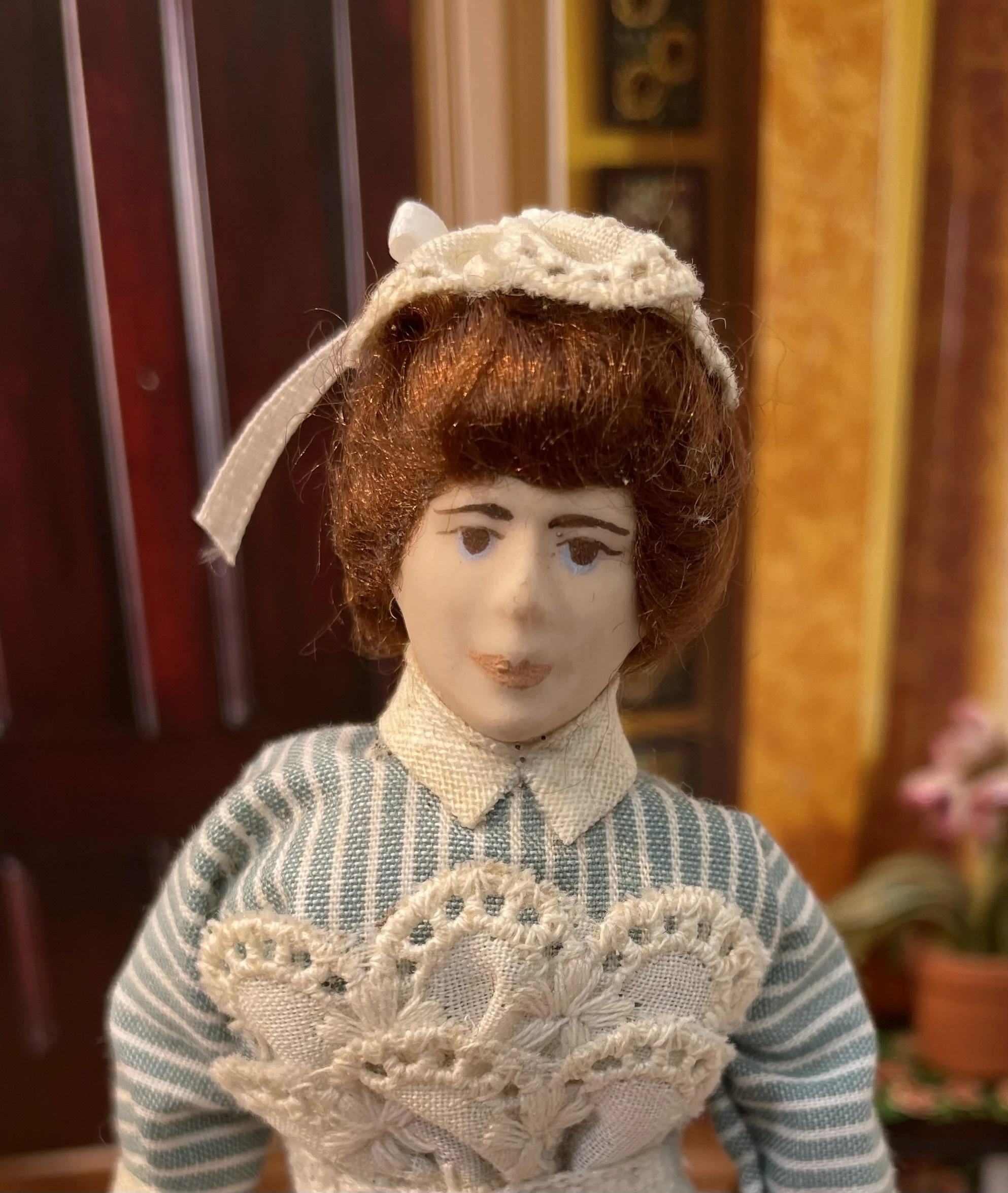 Maid in striped dress