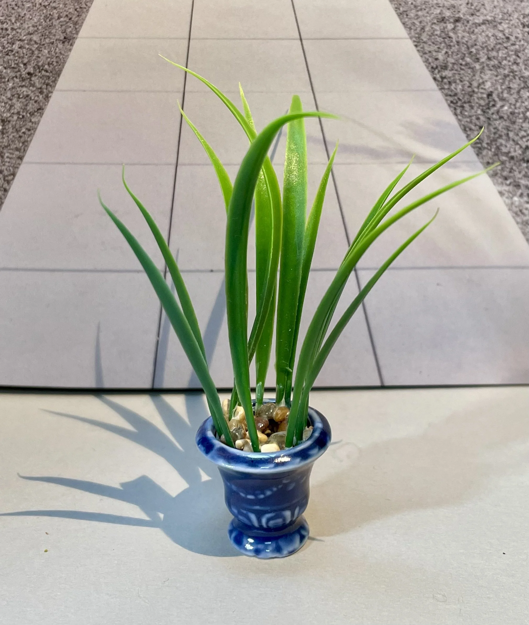 Blue pot of grasses.