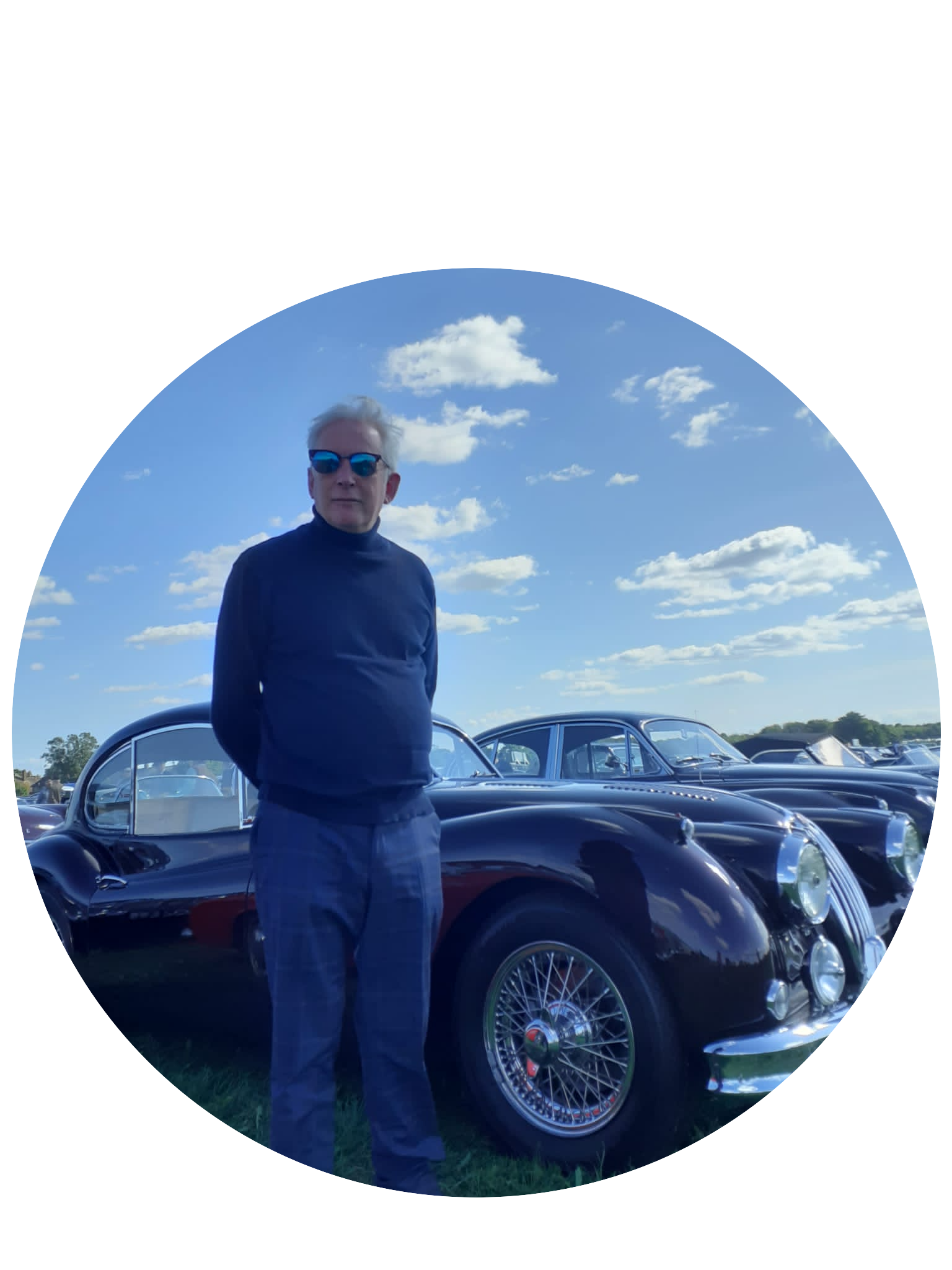 Photo of Brendan in front of a classic car
