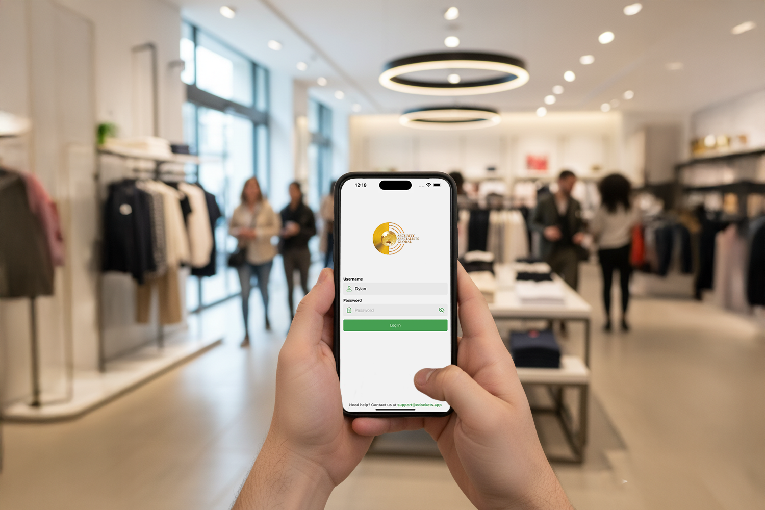 Image of hands holding a phone with the Security Specialists Global online portal login screen