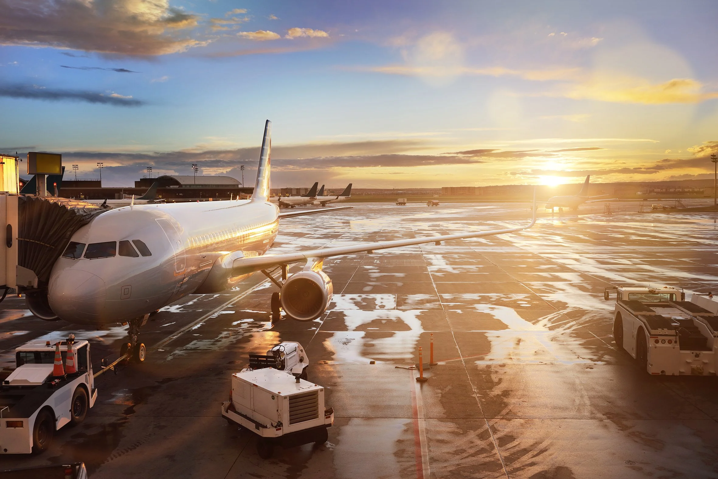 Photo at sunrise of plane sitting on tarmac at airport for valuable cargo services