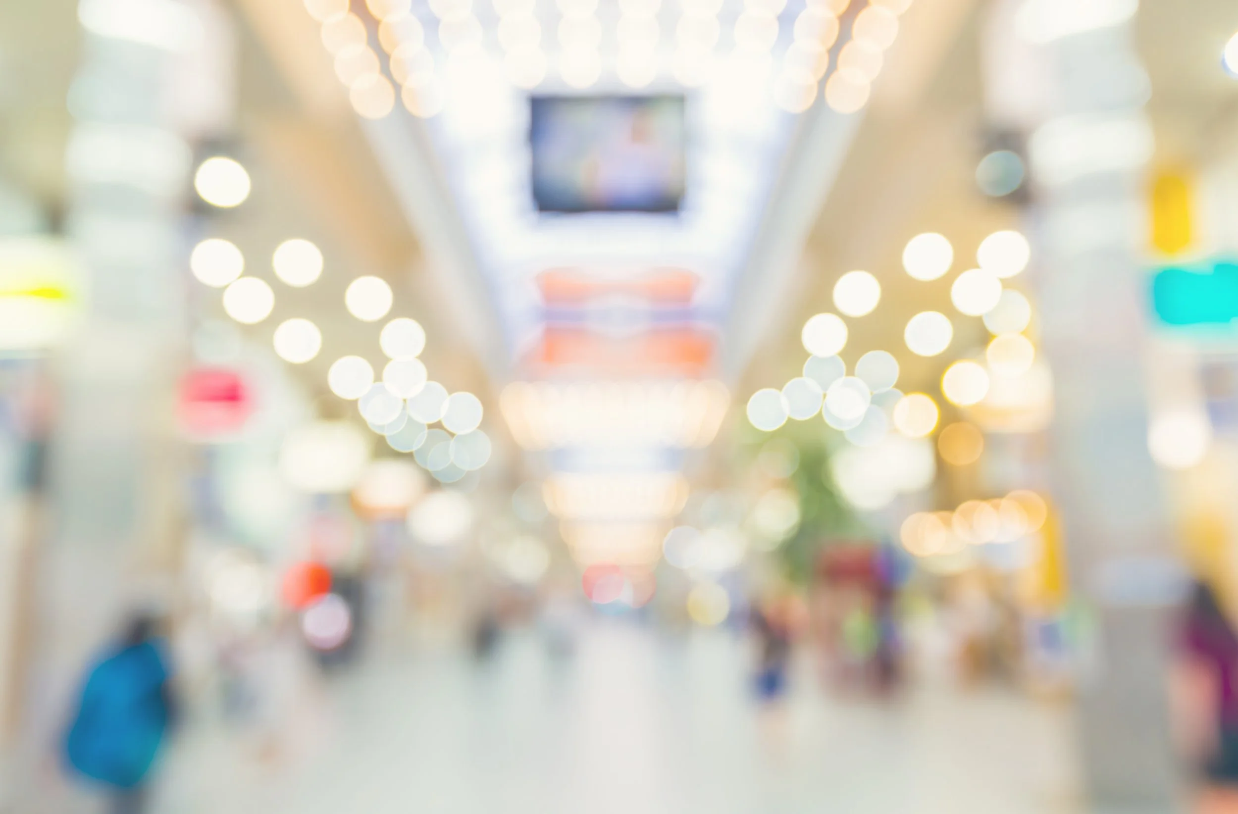 Image of a blurred shopping mall to go with a testimonial