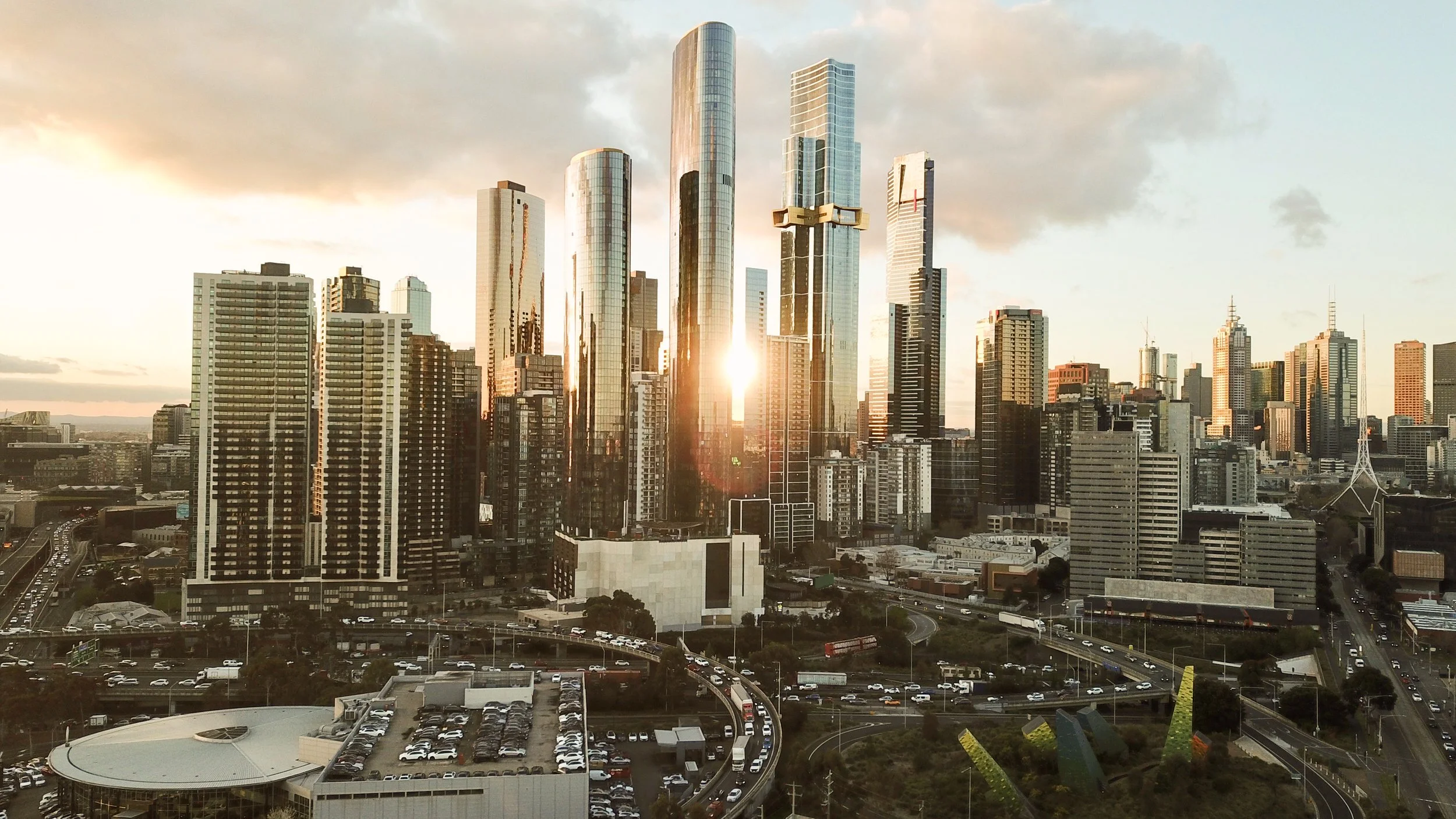 Image of golden sunset coming through CBD buildings of Melbournes skyline