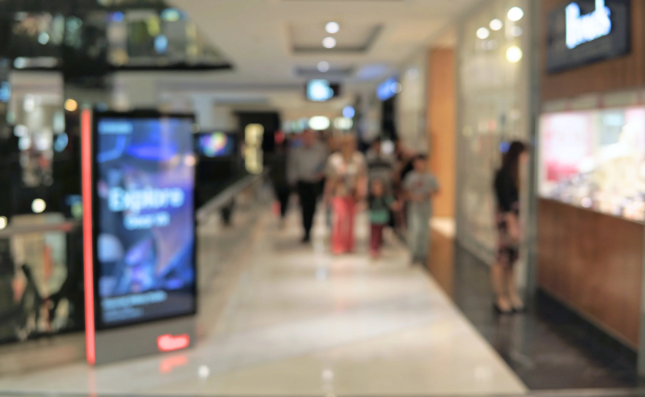 Blurred image of retail shopping mall for Cash-In-Transit Services