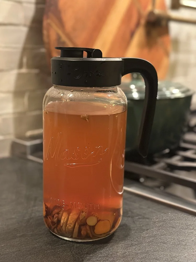Homemade Ginger Turmeric Tea in large mason jar.