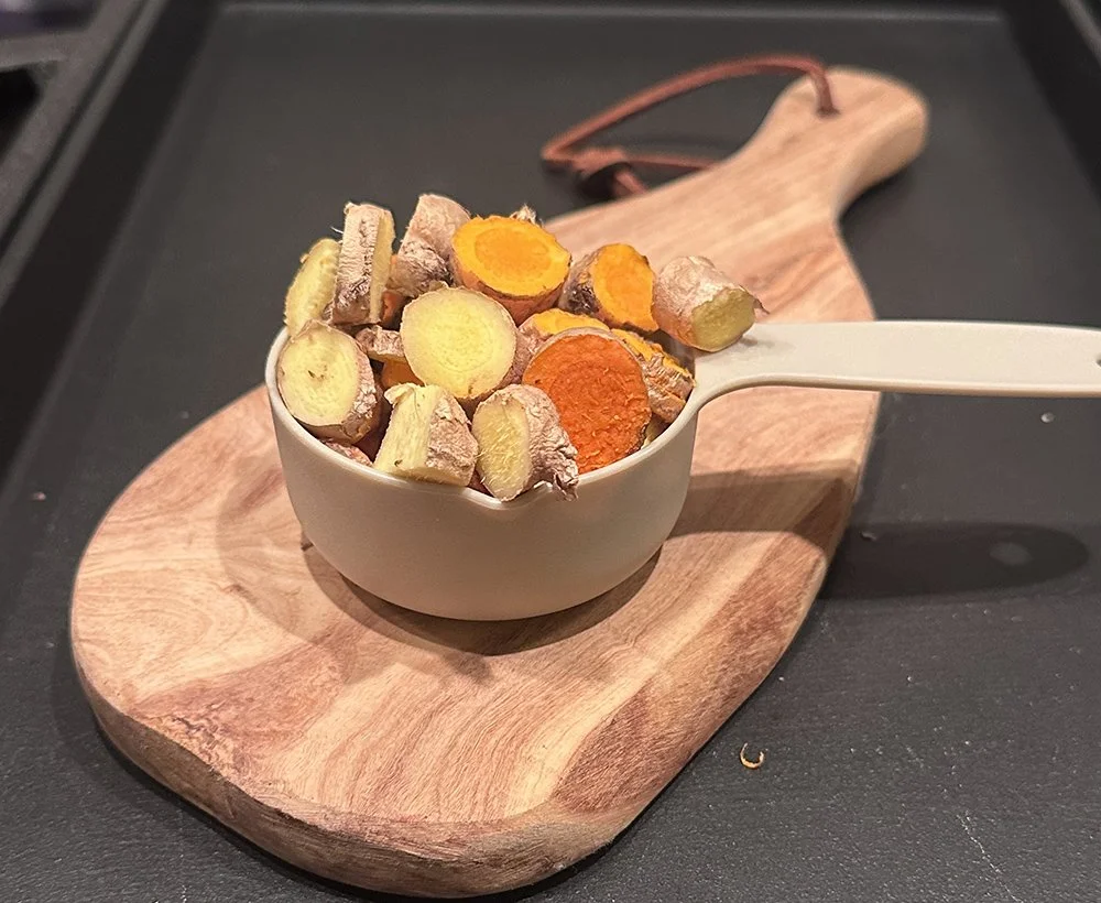 Sliced ginger turmeric in a 1/2 cup container.