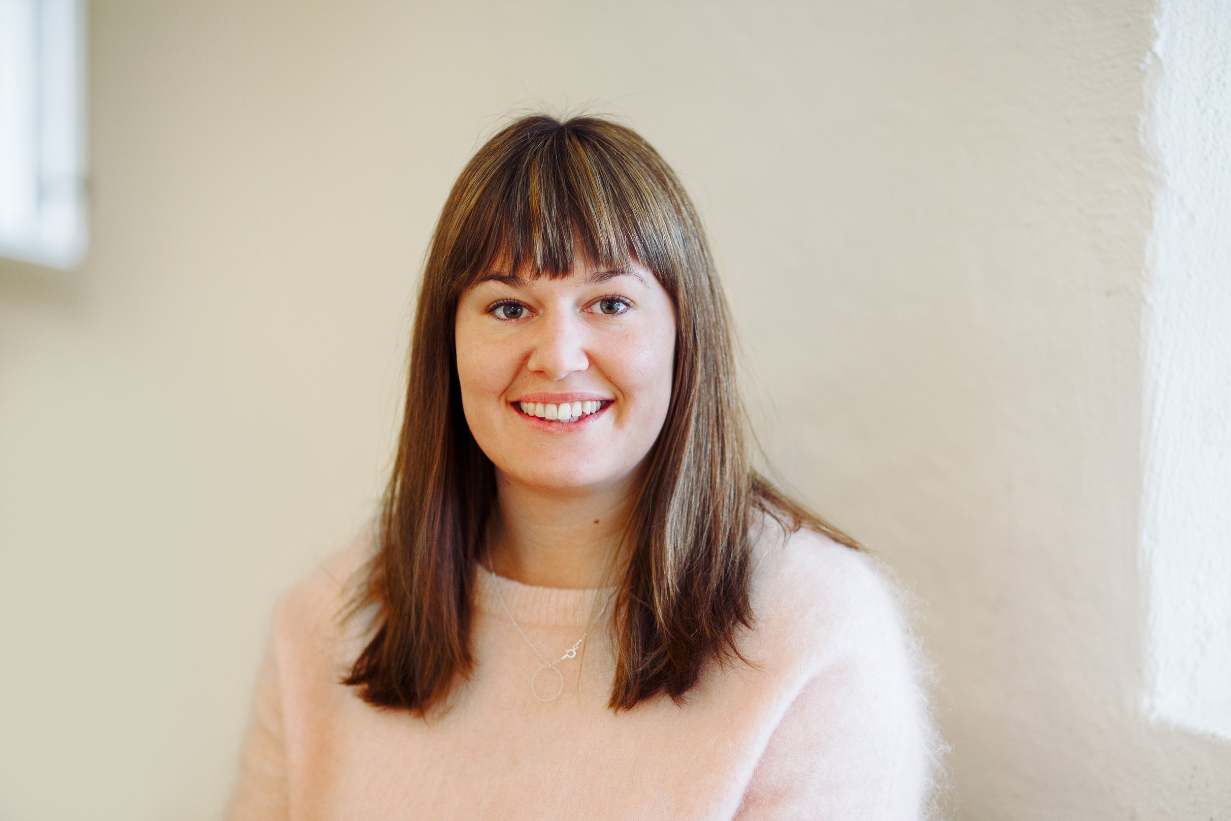 Profesjonelt bedriftsportrett av ansatt.