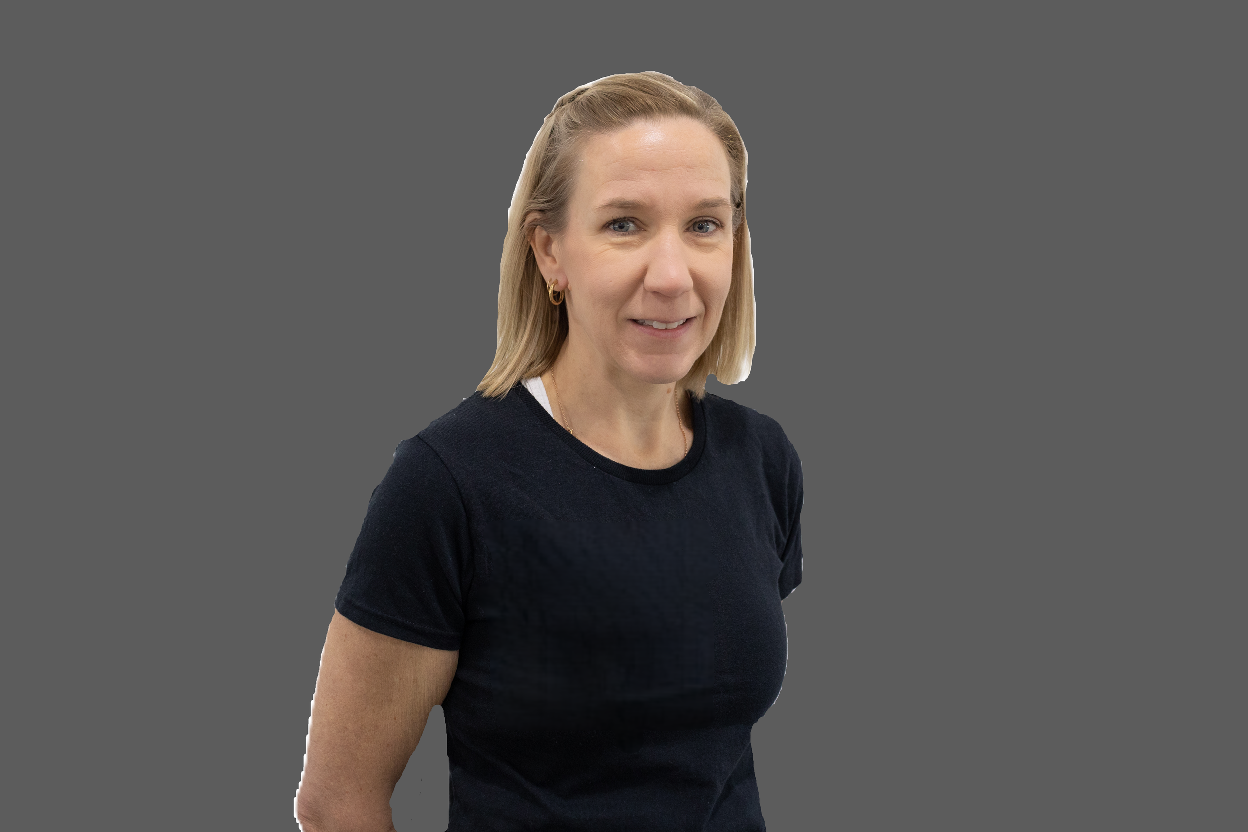 A woman with blonde hair and blue eyes taking a selfie against a blue background, wearing a red lace halter top with sunglasses hanging from the front.