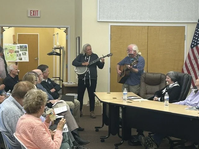 Peacemeal String Band performing for the group before presentations begin.