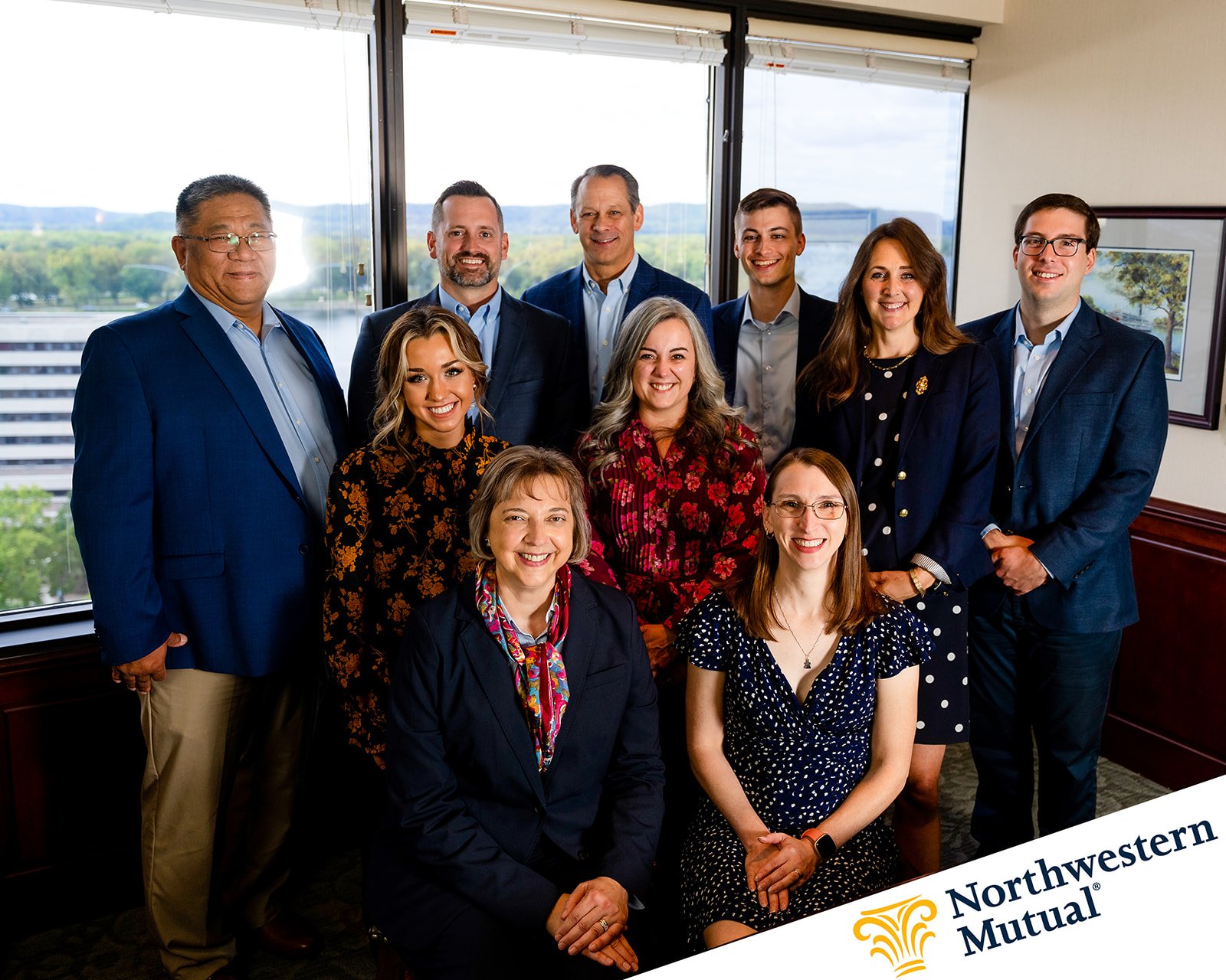 photo of a real estate team posing for a team portrait