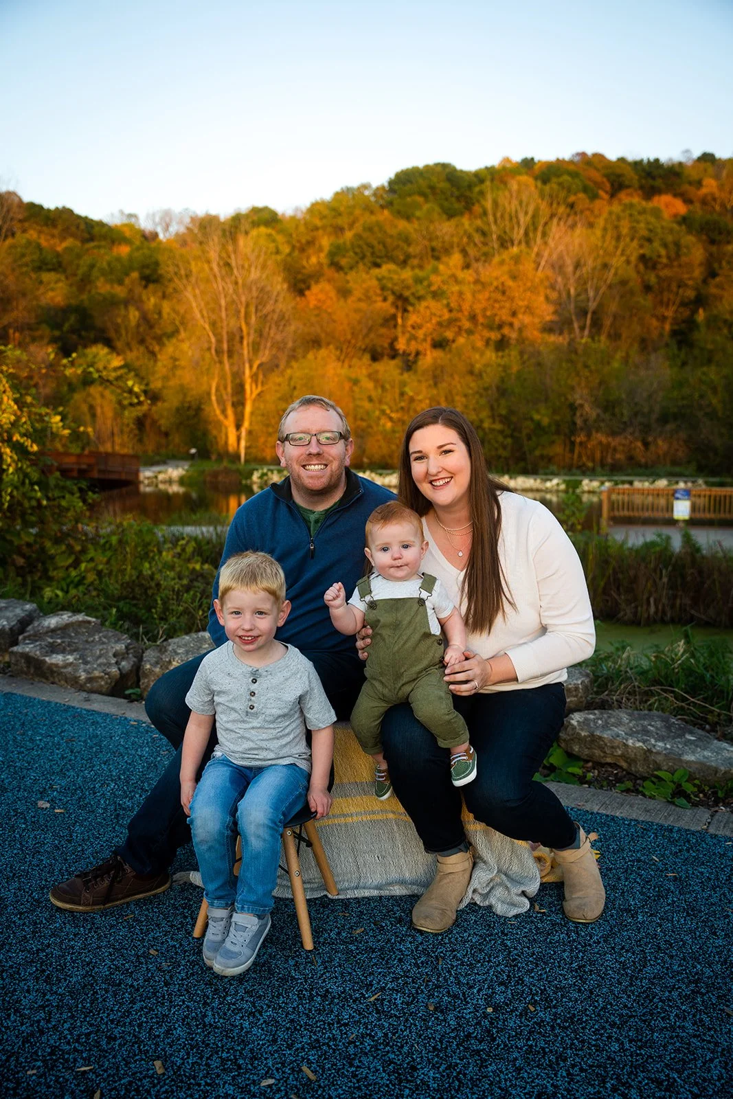 A young family poses for a photo