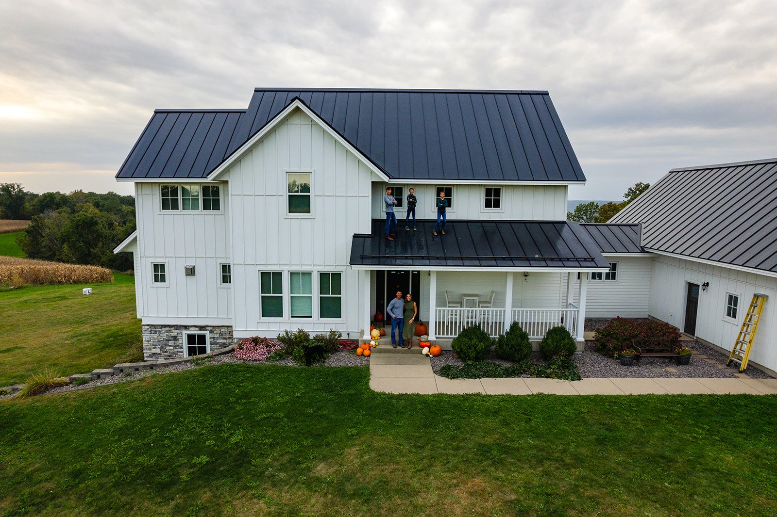 drone photo of a family at their house during sunset