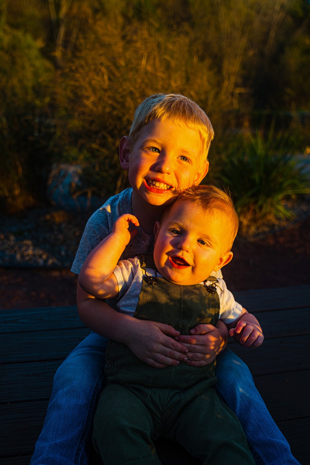 two young kids smile at the camera