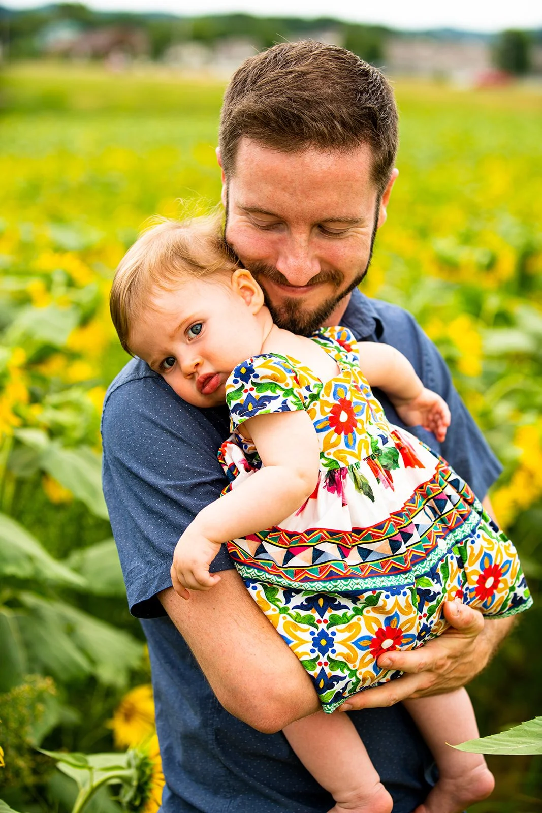 a father poses with his daughter