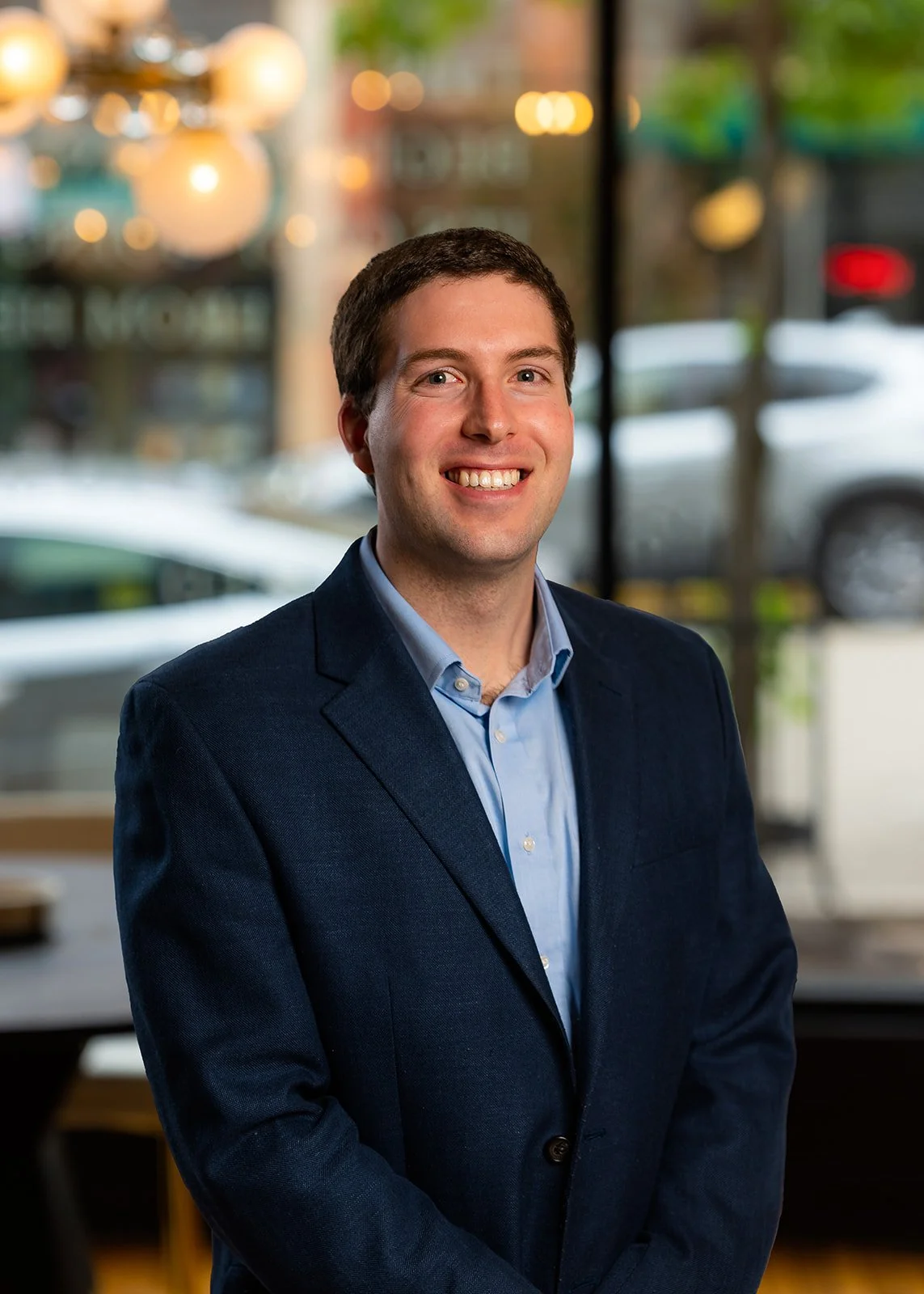 a young professional posing for a studio portrait