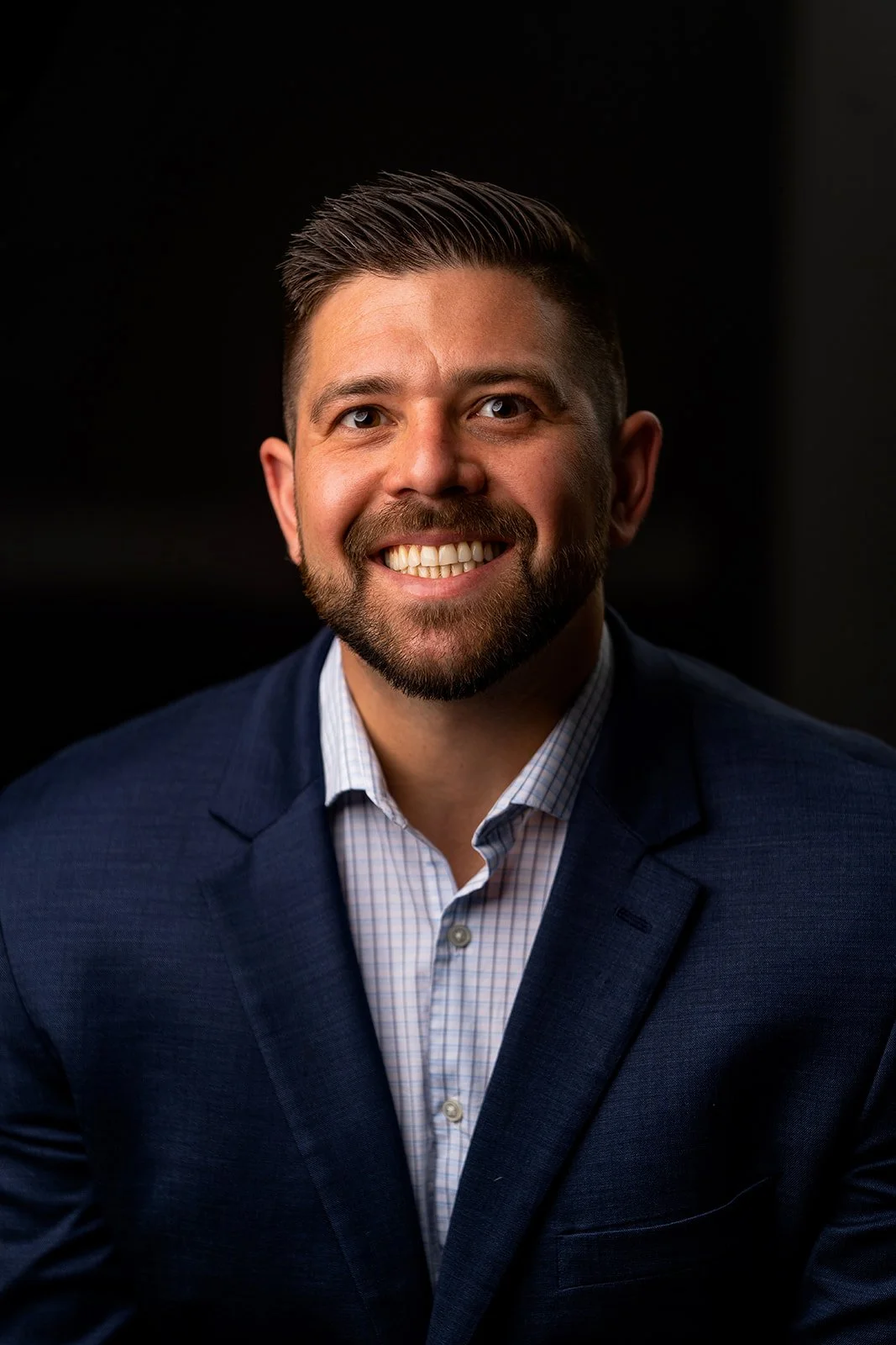 photo of a real estate professional posing for a studio portrait