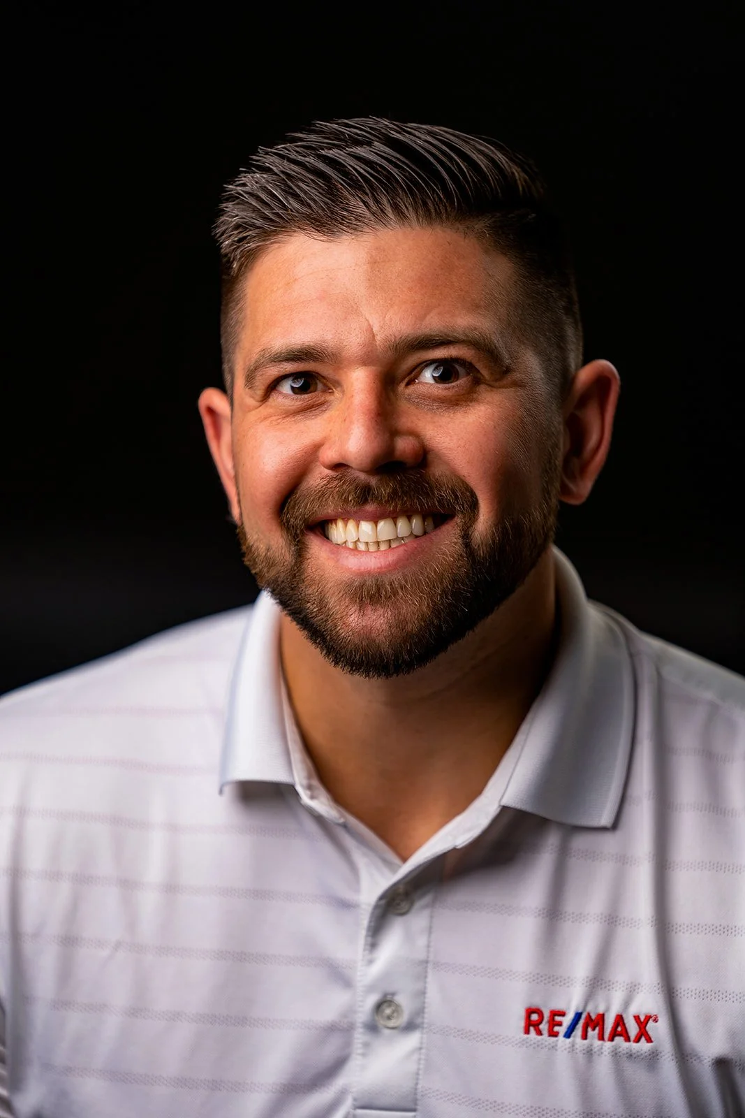 photo of a real estate professional posing for a studio portrait
