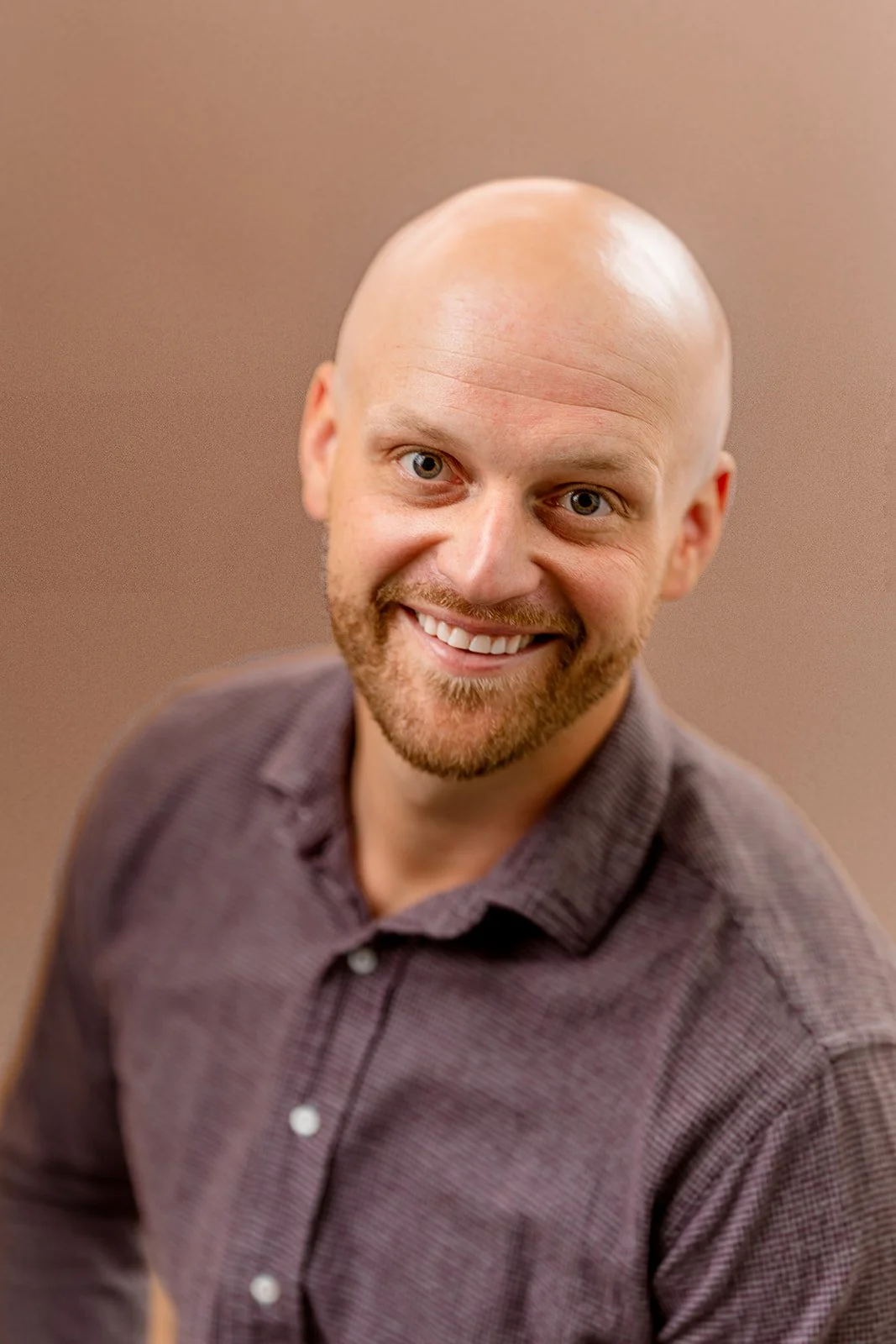 photo of a young man posing for a studio portrait