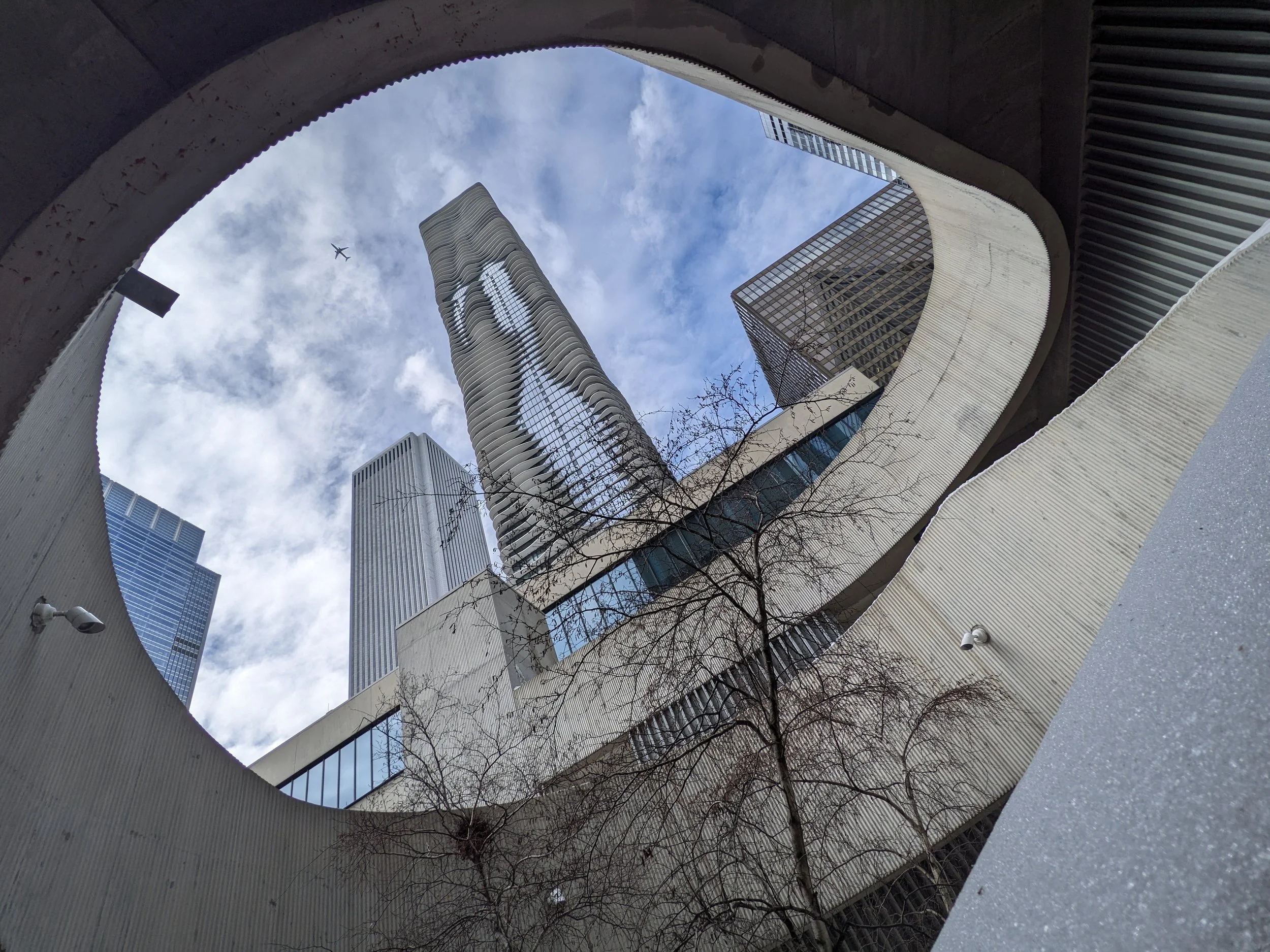 Aqua Tower shot from some access staircase near a cafe. 