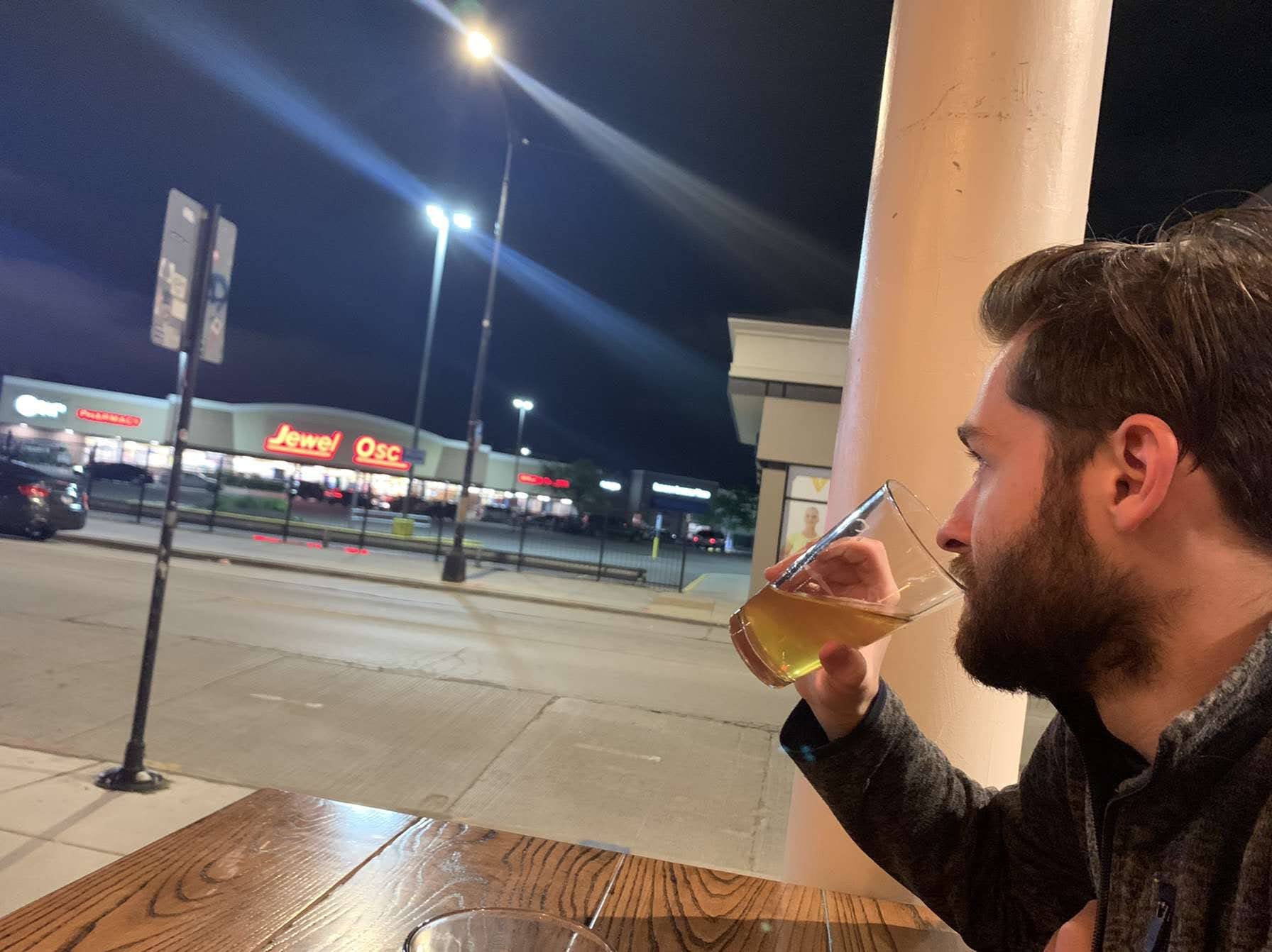 Me, having a beer at a novelty bar, in front of Jewels. 