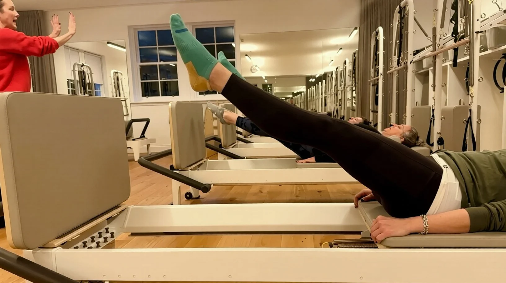 Client jumping on the Reformer jumpboard at Luma Pilates, Edinburgh