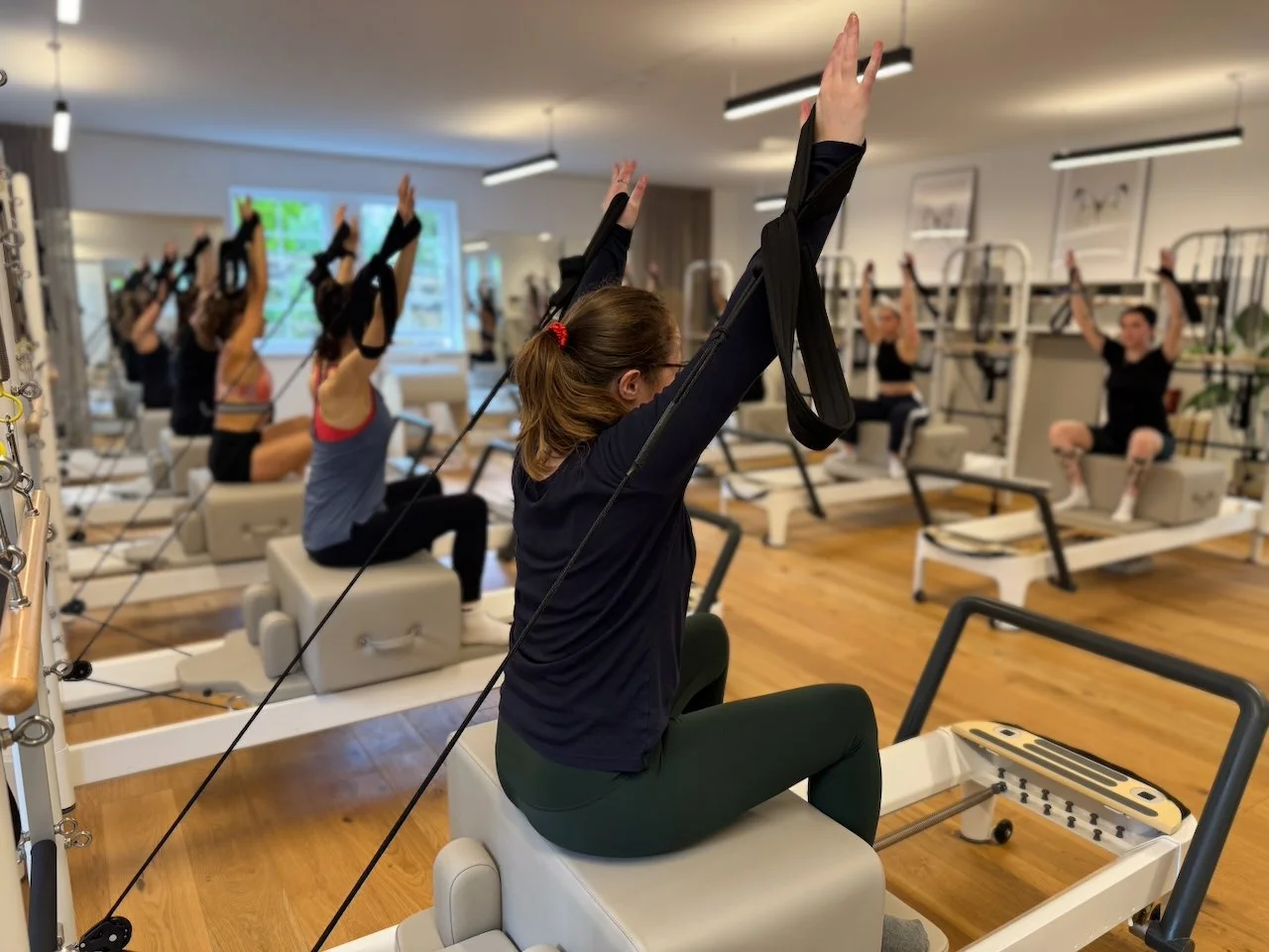 A group Reformer Fundamentals class at Luma Pilates, Edinburgh