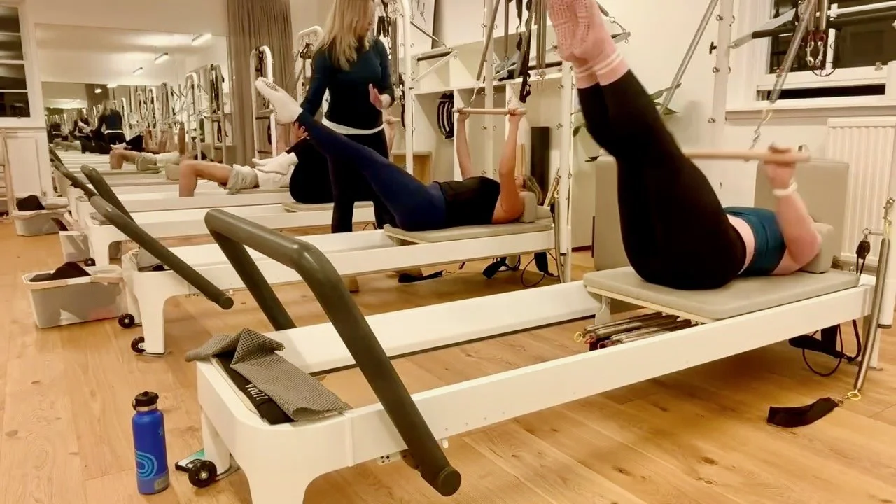 Lucia Poulter teaching a Reformer Pilates class at Luma Pilates Edinburgh