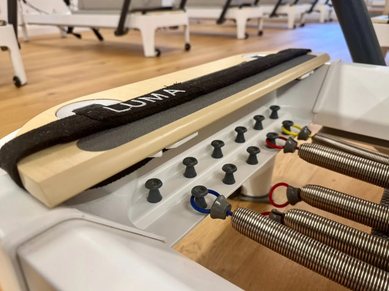Close-up of Reformer spring resistance mechanism at Luma Pilates studio, Edinburgh