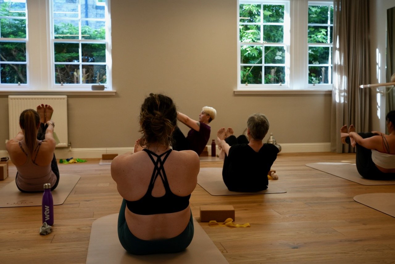 Kat Aydin cueing clients during a Yoga class in Studio B at Luma Pilates Edinburgh