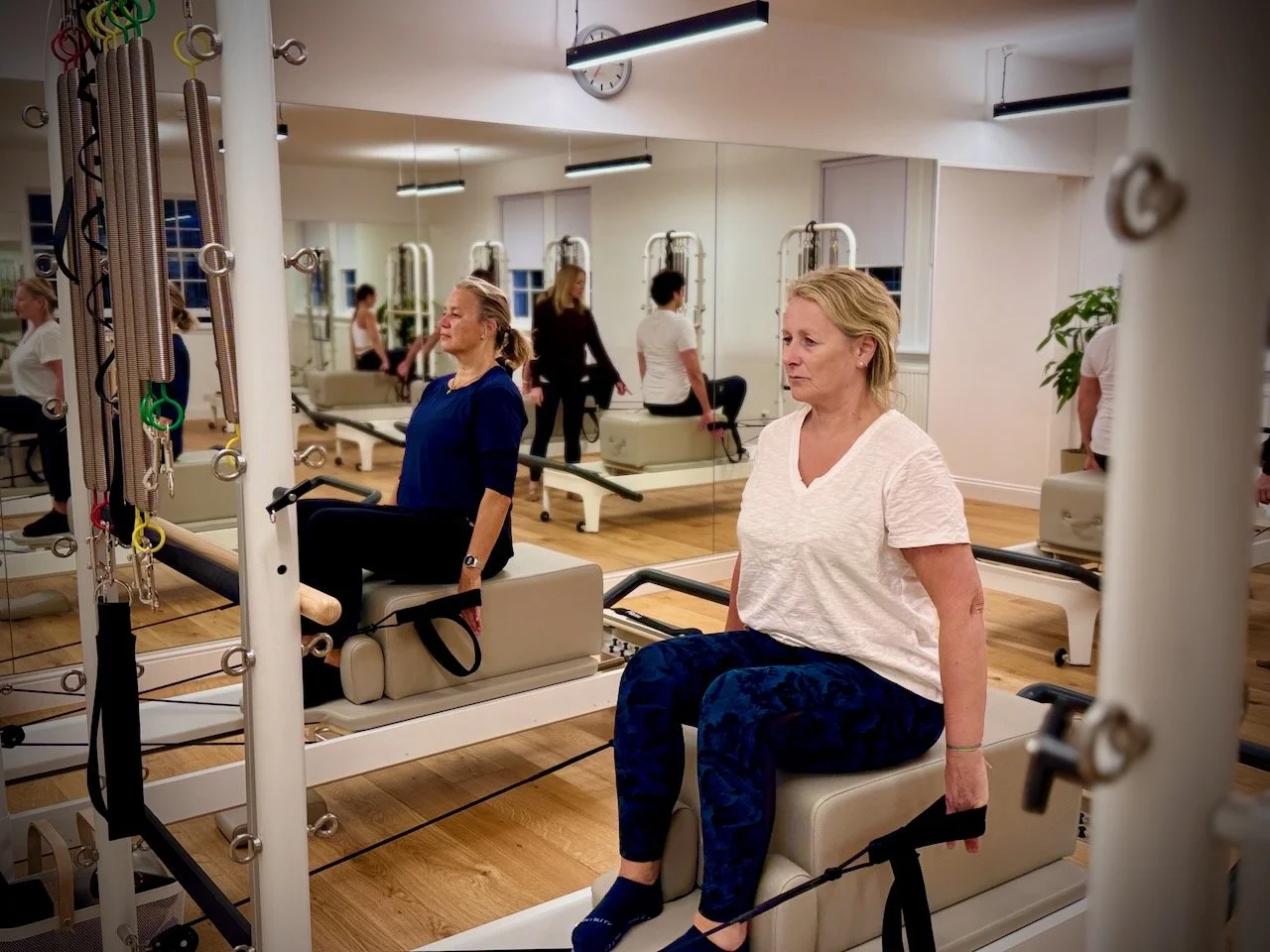 Lucia Poulter teaching a group Reformer Pilates session at Luma Pilates in Edinburgh's New Town