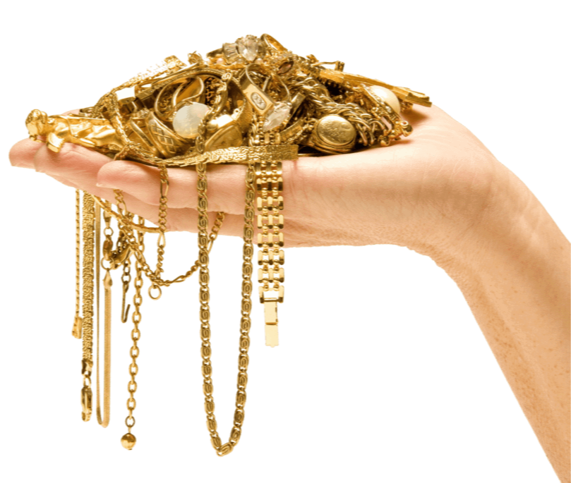 A hand holding a pile of gold jewelry including necklaces, chains, and bracelets.