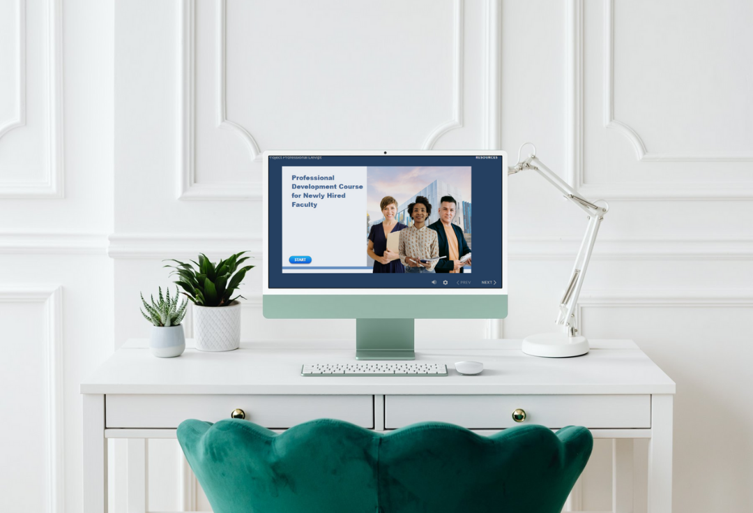 Computer monitor on a white desk displaying an online course titled 'Professional Development Course for Newly Hired Faculty' with images of three people, flanked by two potted plants and a white desk lamp in a bright room.